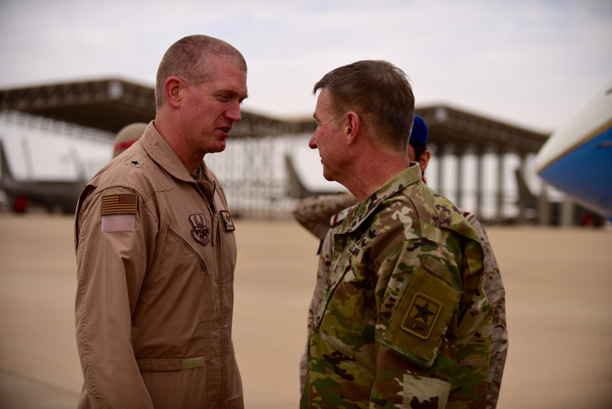 U.S. Army Chief of Staff, Gen. James McConville, greets U.S. Air Force Brig. Gen. John Walker, 378th Air Expeditionary Wing commander, during his visit to Prince Sultan Air Base, Kingdom of Saudi Arabia, Dec. 18, 2019.