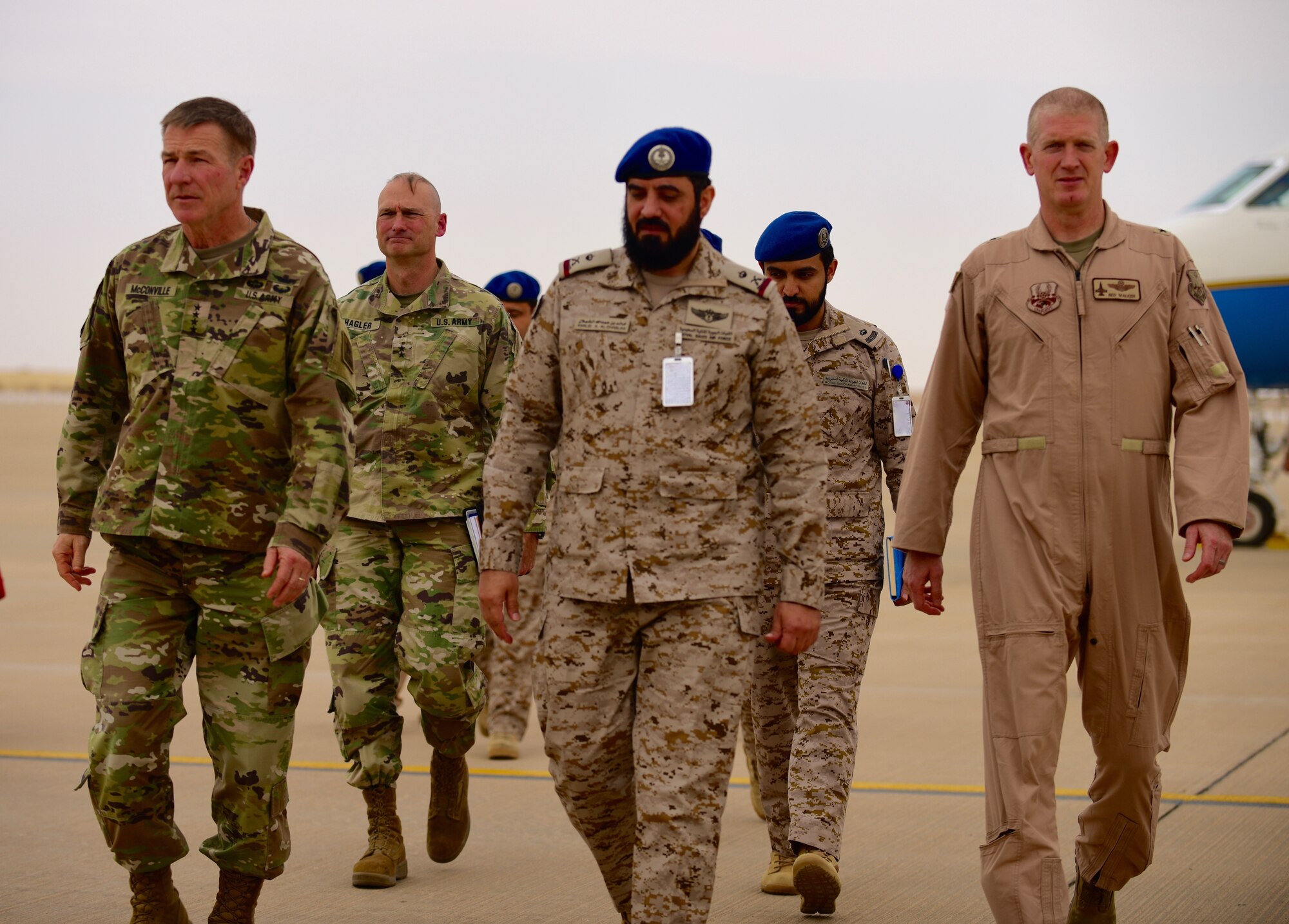 U.S. Army Chief of Staff, Gen. James McConville (left), accompanies Royal Saudi Air Force Maj. Gen. Khalid Al-Shablan (center), and U.S. Air Force Brig. Gen. John C. Walker (right), 378th Air Expeditionary Wing commander, on the flightline at Prince Sultan Air Base, Kingdom of Saudi Arabia, Dec. 18, 2019.