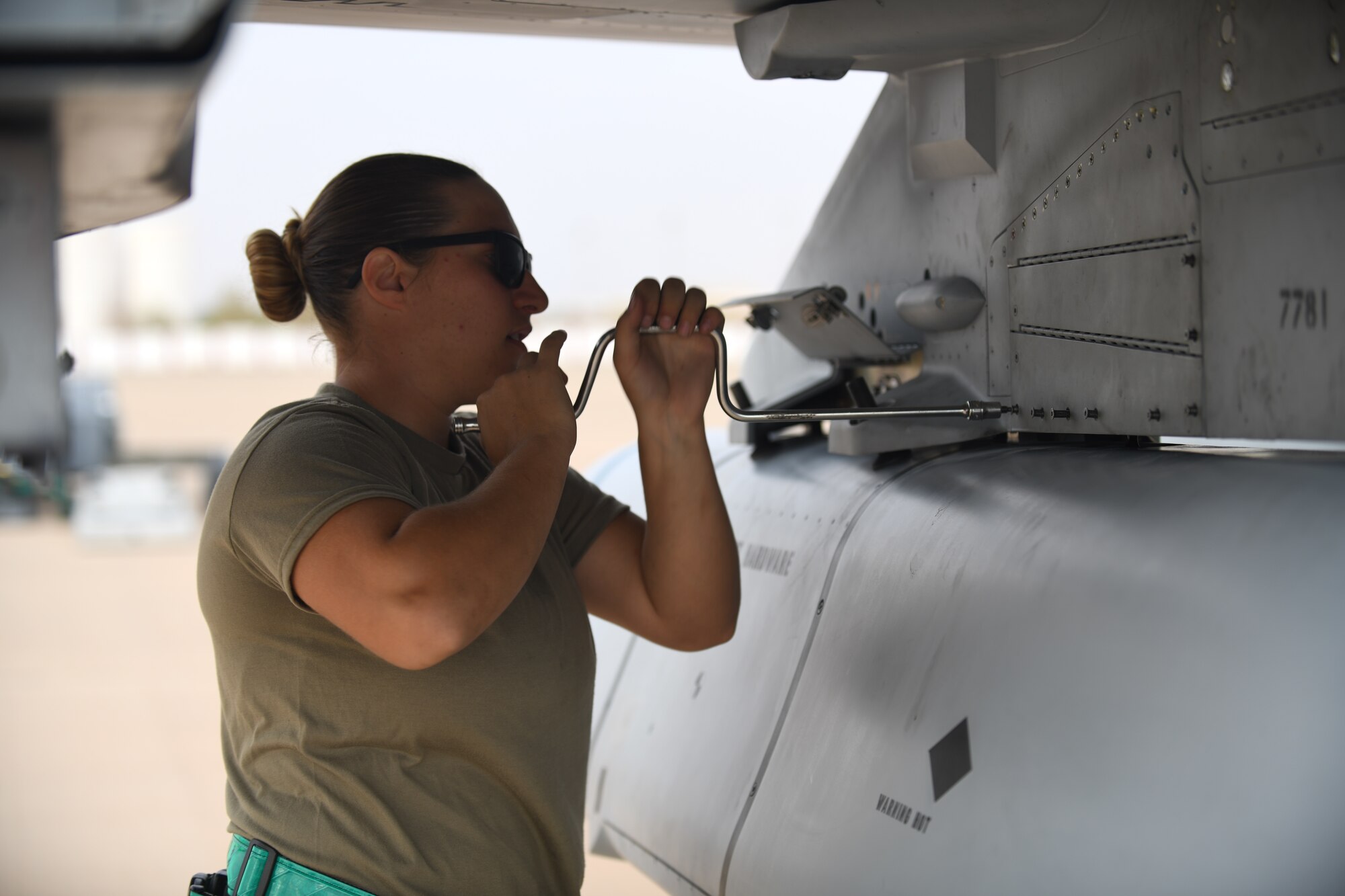 U.S. Air Force Senior Airman Eleanor Lapi, 555th Expeditionary Aircraft Maintenance Unit crew chief, opens the panel of an F-16 Fighting Falcon, assigned to the 555th Expeditionary Fighter Squadron, Dec. 2, 2019 at Prince Sultan Air Base, Saudi Arabia.