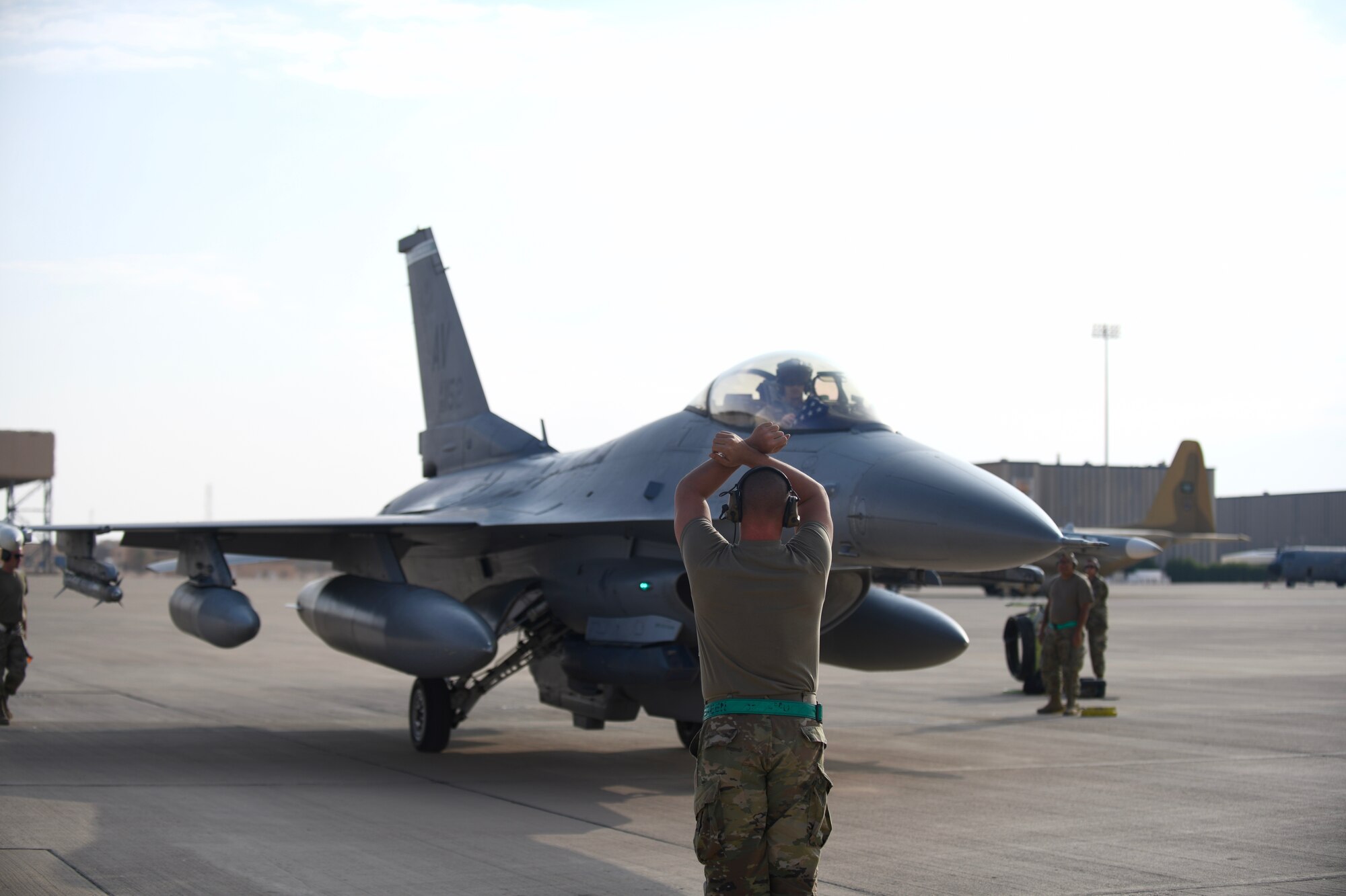 U.S. Air Force Staff Sgt. Hogan Hutchins, 555th Expeditionary Aircraft Maintenance Unit avionics specialist, taxis an F-16 Fighting Falcon, assigned to the 555th Expeditionary Fighter Squadron, into place Dec. 2, 2019 at Prince Sultan Air Base.