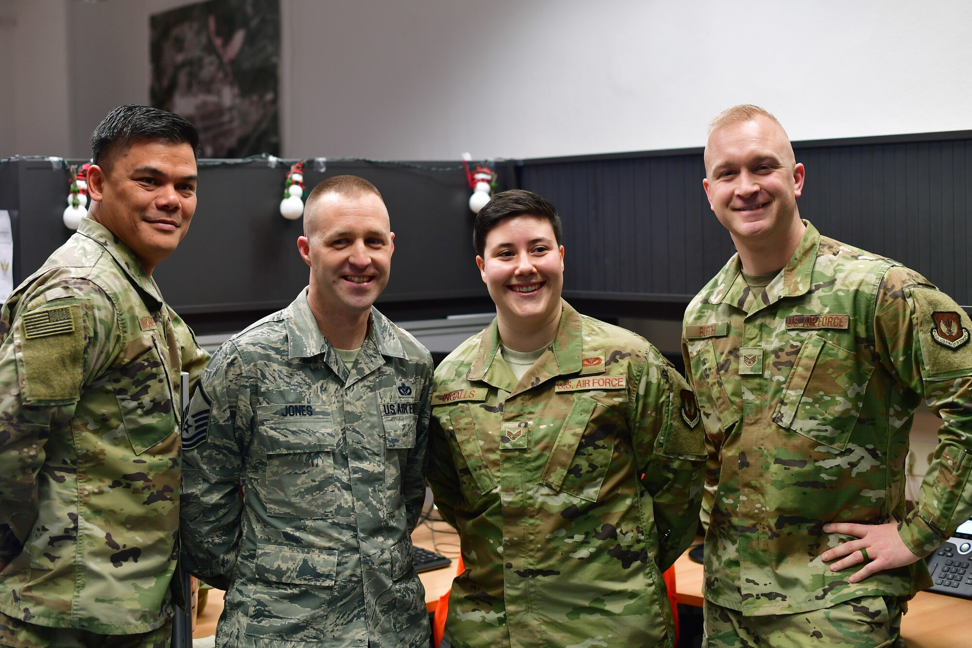 U.S. Air Force Senior Master Sgt. Arturo Quinones, 786th Civil Engineer Squadron facilities superintendent, left, Master Sgt. Justin Jones, 786th CES requirements and optimization section chief, Senior Airman Ariana M. Ingalls, 786th CES pavement and equipment journeyman, and Staff Sgt. Joshua Burch, 786th CES data analytics NCO in charge, pose for a photo during a gathering of leadership and peers to recognize Ingalls as Airlifter of the Week at Ramstein Air Base, Germany, Dec. 19, 2019. Ingalls coordinated the building and operation of a haunted house during Fall 2019, that raised $4,800 for scholarships given to Kaiserslautern Military Community high school seniors and $750 for the CES Booster Club. (U.S. Air Force photo by Airman 1st Class John R. Wright)