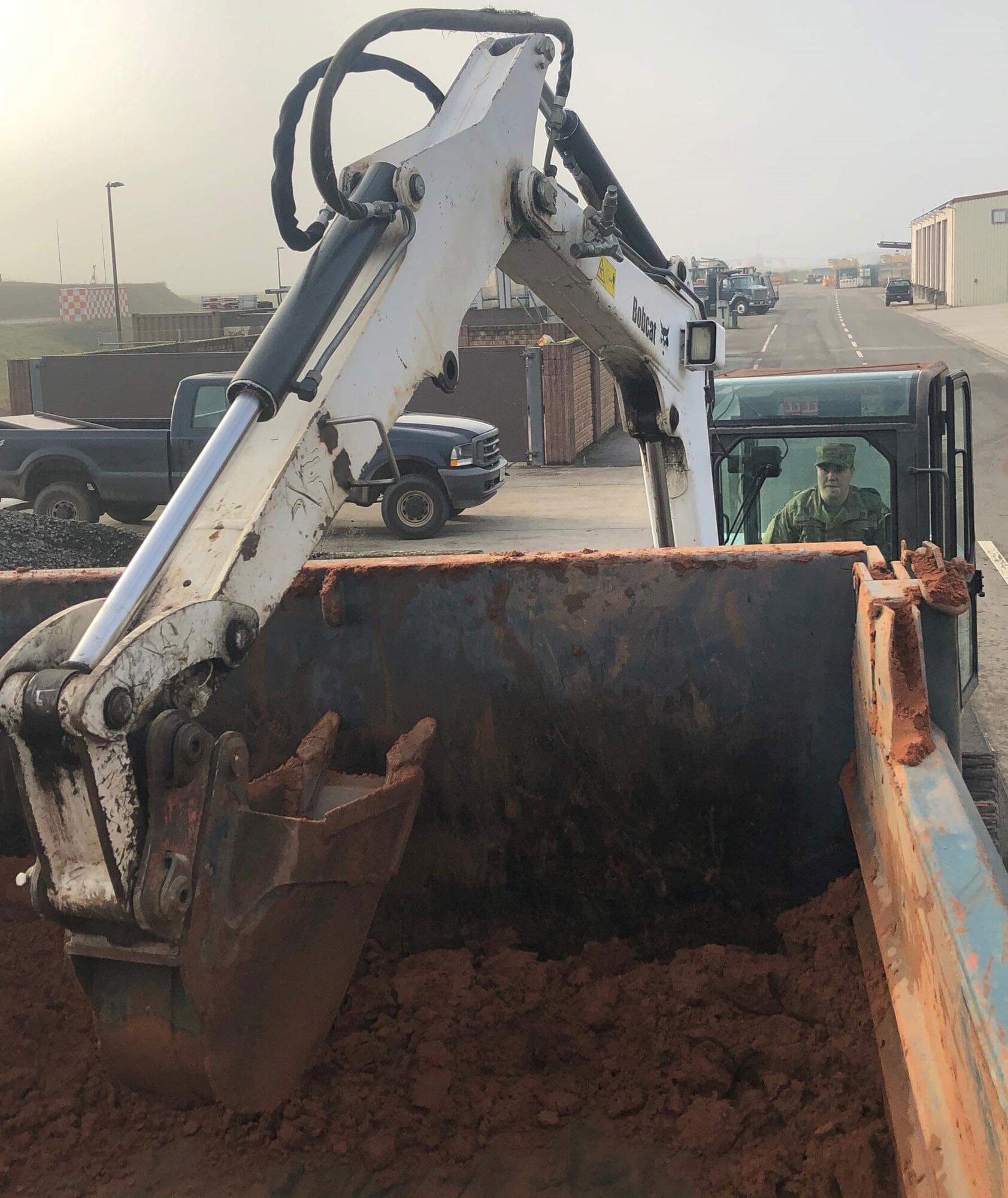 U.S. Air Force Senior Airman Ariana M. Ingalls, 786th Civil Engineer Squadron pavement and equipment journeyman, moves dirt with an excavator on Ramstein Air Base, Germany. Ingalls, a Johnston, Colorado, native, was commended as Airlifter of the Week, Dec. 19, 2019, for demonstrating outstanding work in the facilitation of installation support. (Courtesy photo)
