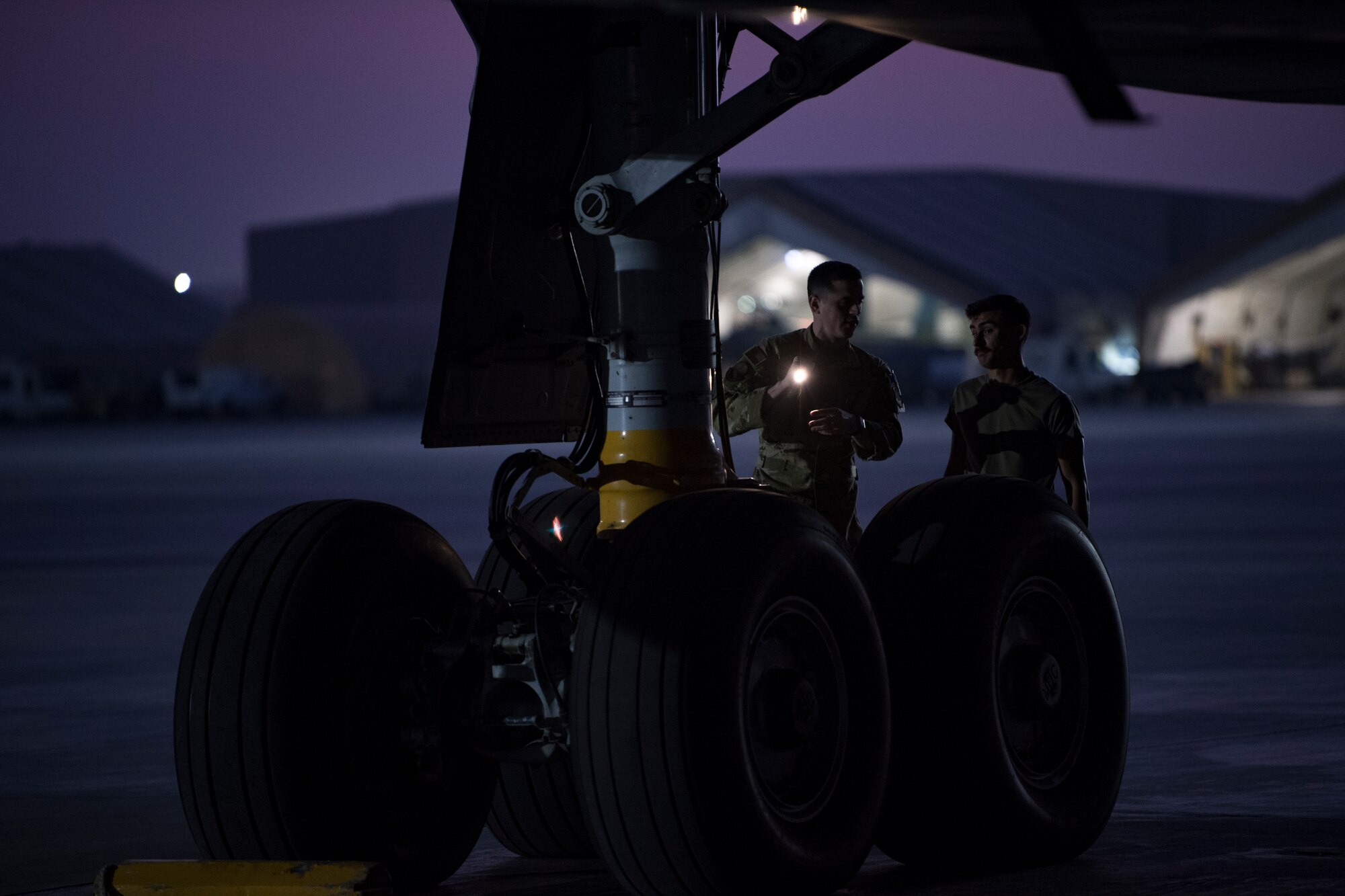 U.S. Air Force Airmen assigned to the 380th Expeditionary Wing conduct preflight inspections on a 908th Expeditionary Air Refueling Squadron (EARS) KC-10 Extender, at Al Dahfra Air Base, United Arab Emirates Dec. 17, 2019.
