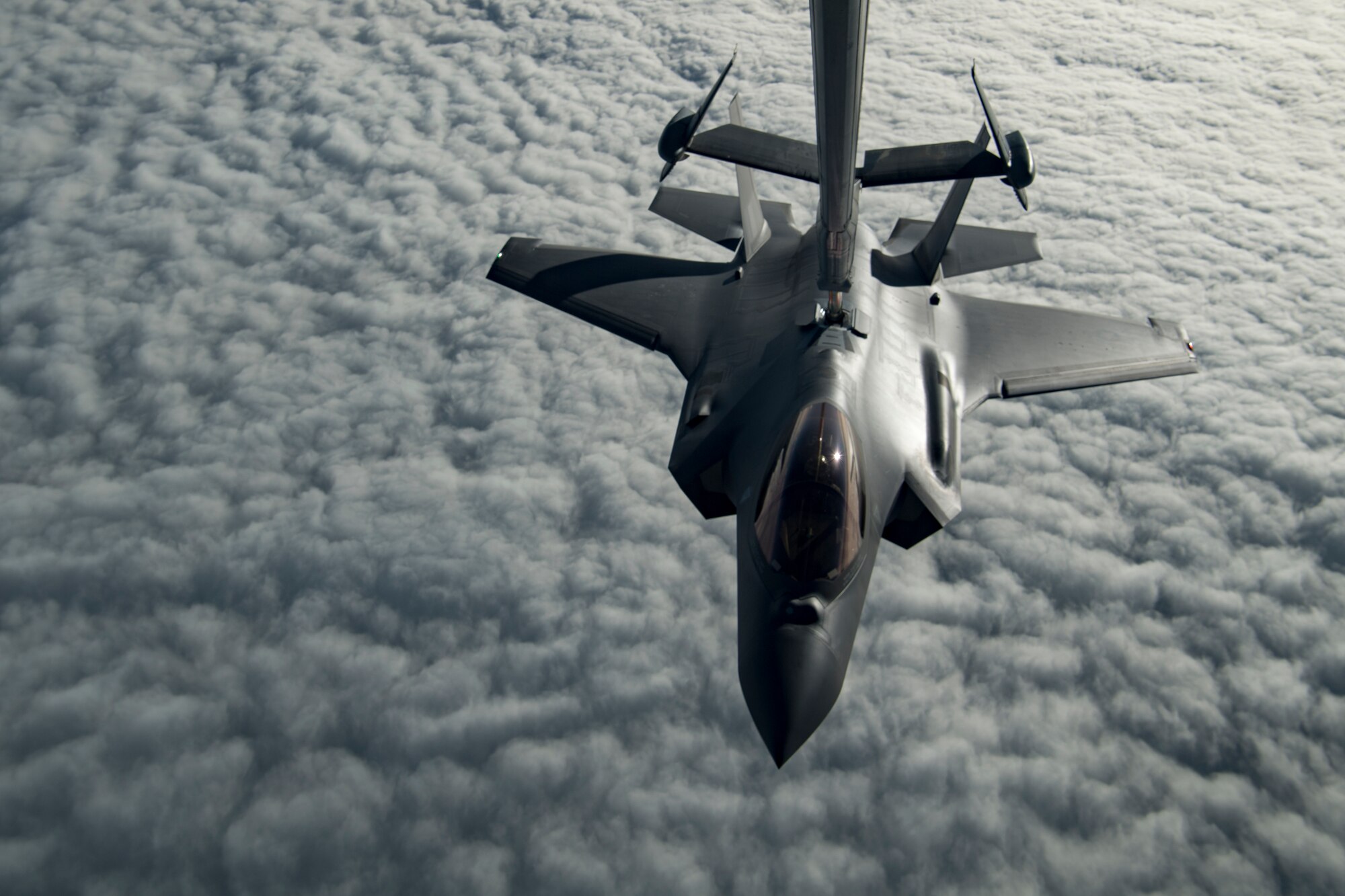 A U.S. Air Force KC-10 Extender boom operator with the 908th Expeditionary Air Refueling Squadron (EARS) from Al Dhafra Air Base (ADAB), United Arab Emirates, conducts an aerial refueling with a U.S. Air Force F-35A Lightning II assigned to the 34th Expeditionary Fighter Squadron, also from ADAB, in support of Operation Inherent Resolve, Dec. 17, 2019.