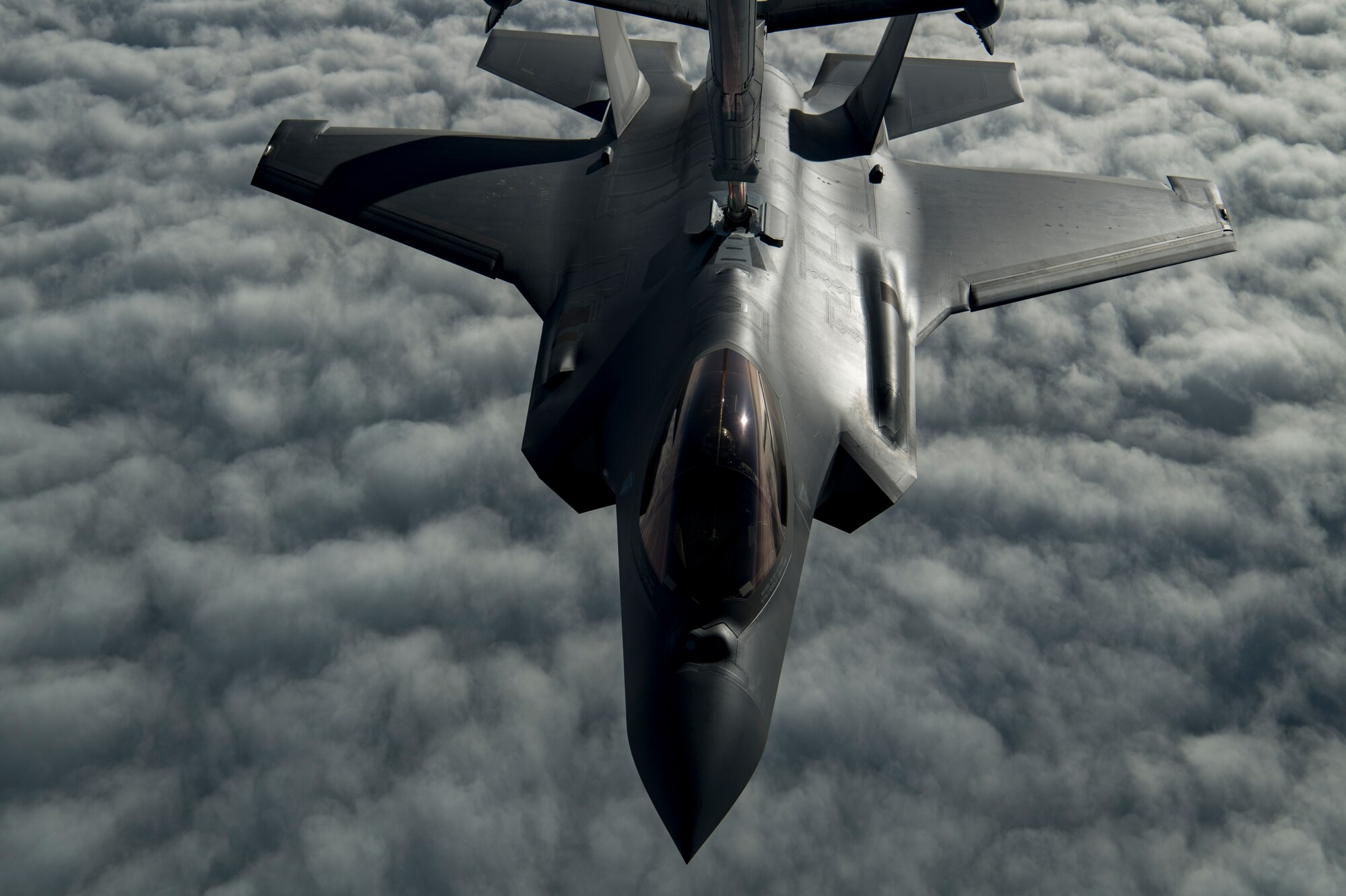 A U.S. Air Force KC-10 Extender boom operator with the 908th Expeditionary Air Refueling Squadron (EARS) from Al Dhafra Air Base (ADAB), United Arab Emirates, conducts an aerial refueling with a U.S. Air Force F-35A Lightning II assigned to the 34th Expeditionary Fighter Squadron, also from ADAB, in support of Operation Inherent Resolve, Dec. 17, 2019.