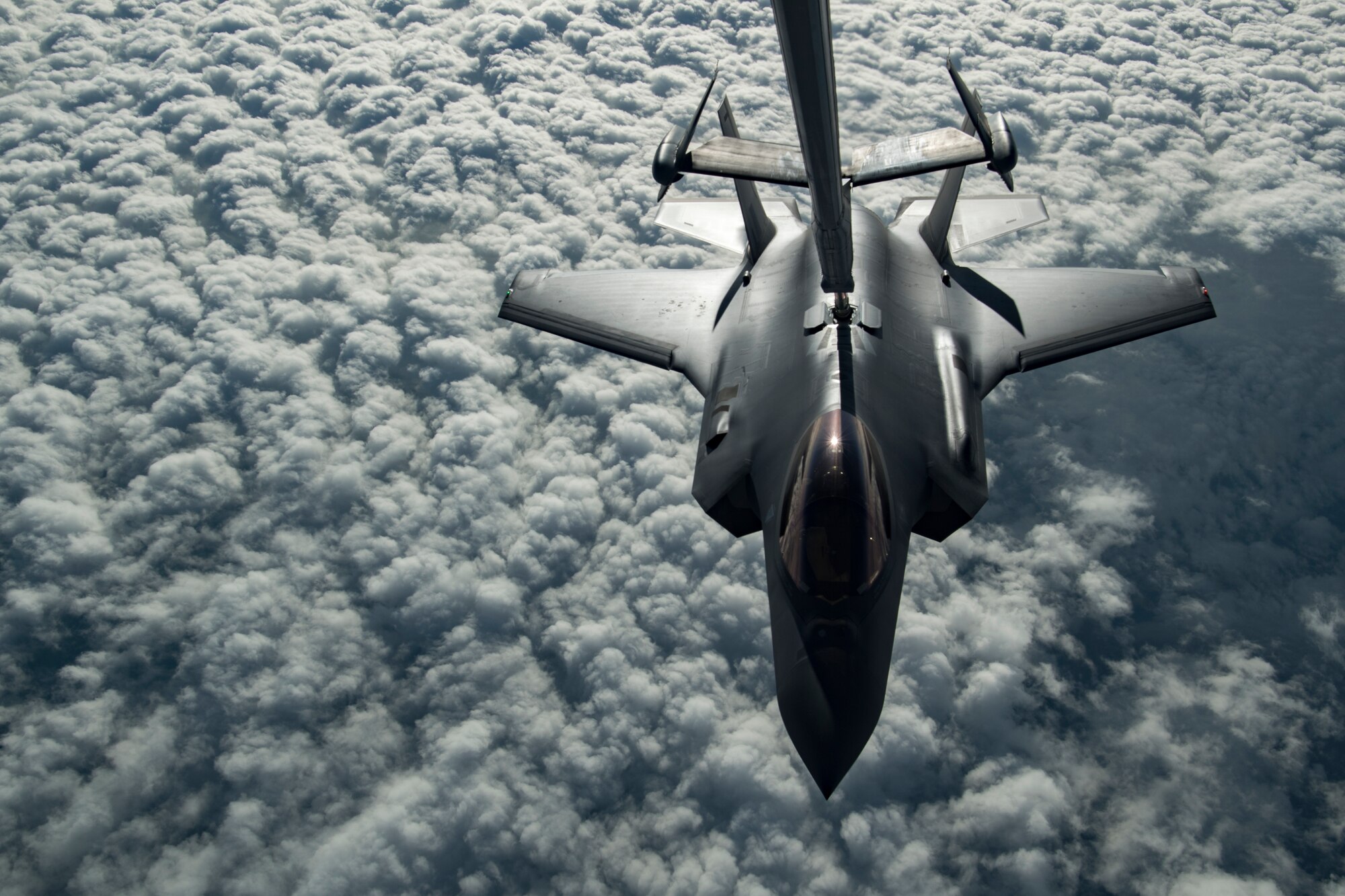 A U.S. Air Force KC-10 Extender boom operator with the 908th Expeditionary Air Refueling Squadron (EARS) from Al Dhafra Air Base (ADAB), United Arab Emirates, conducts an aerial refueling with a U.S. Air Force F-35A Lightning II assigned to the 34th Expeditionary Fighter Squadron, also from ADAB, in support of Operation Inherent Resolve, Dec. 17, 2019.