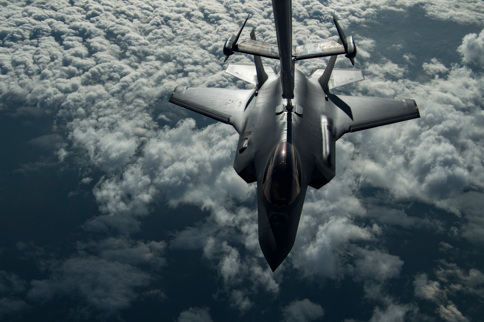 A U.S. Air Force KC-10 Extender boom operator with the 908th Expeditionary Air Refueling Squadron (EARS) from Al Dhafra Air Base (ADAB), United Arab Emirates, conducts an aerial refueling with a U.S. Air Force F-35A Lightning II assigned to the 34th Expeditionary Fighter Squadron, also from ADAB, in support of Operation Inherent Resolve, Dec. 17, 2019.