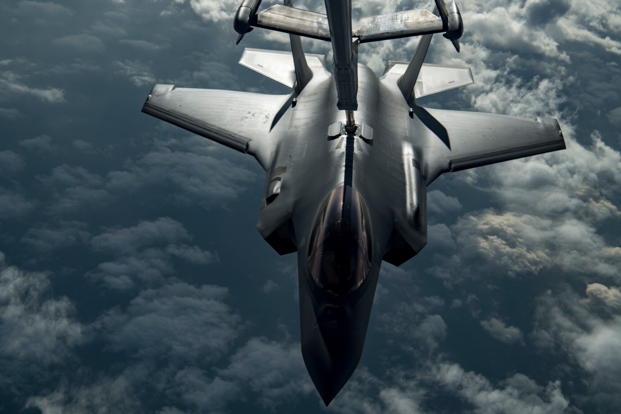 A U.S. Air Force KC-10 Extender boom operator with the 908th Expeditionary Air Refueling Squadron (EARS) from Al Dhafra Air Base (ADAB), United Arab Emirates, conducts an aerial refueling with a U.S. Air Force F-35A Lightning II assigned to the 34th Expeditionary Fighter Squadron, also from ADAB, in support of Operation Inherent Resolve, Dec. 17, 2019.