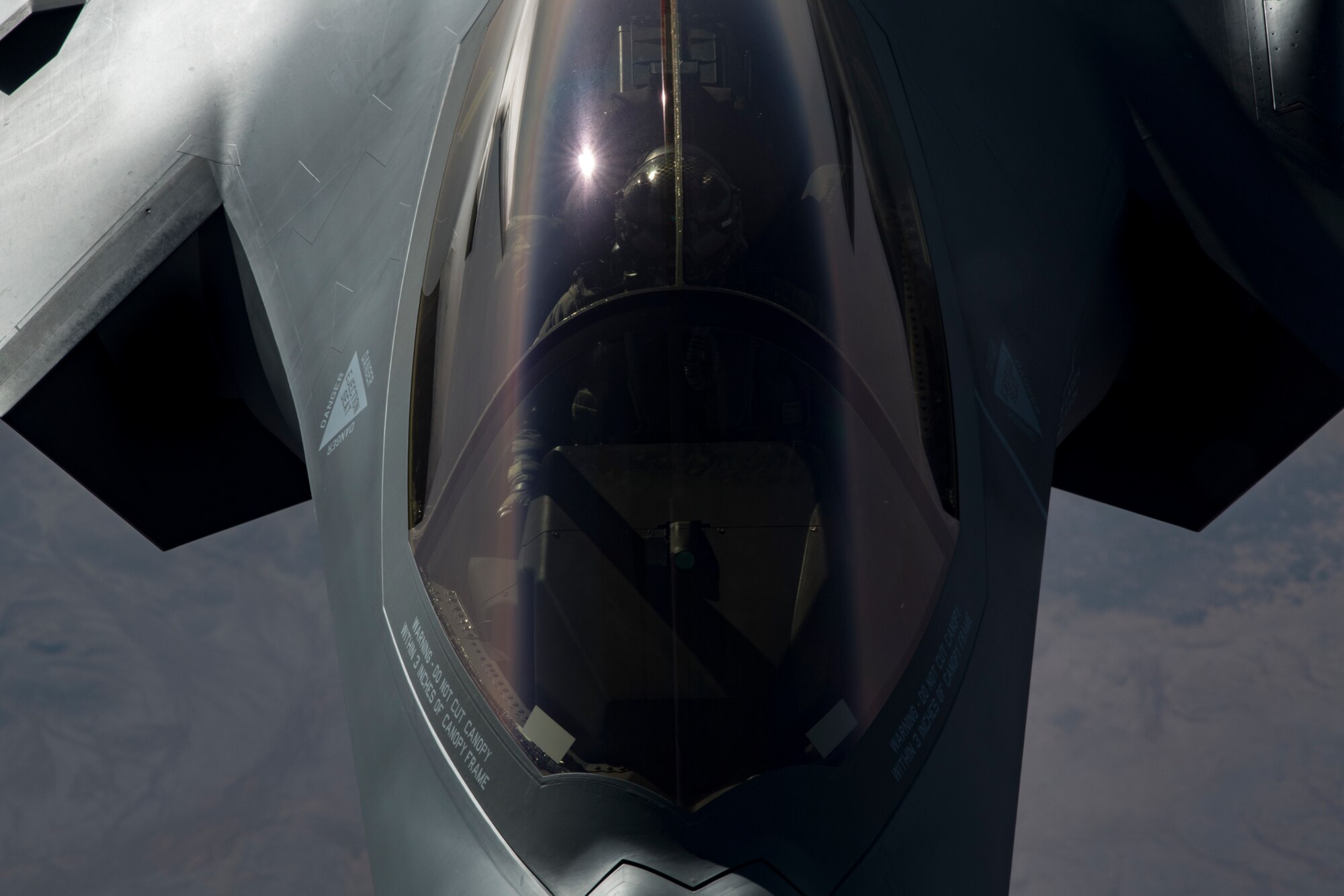 A U.S. Air Force KC-10 Extender boom operator with the 908th Expeditionary Air Refueling Squadron (EARS) from Al Dhafra Air Base (ADAB), United Arab Emirates, conducts an aerial refueling with a U.S. Air Force F-35A Lightning II assigned to the 34th Expeditionary Fighter Squadron, also from ADAB, in support of Operation Inherent Resolve, Dec. 17, 2019.