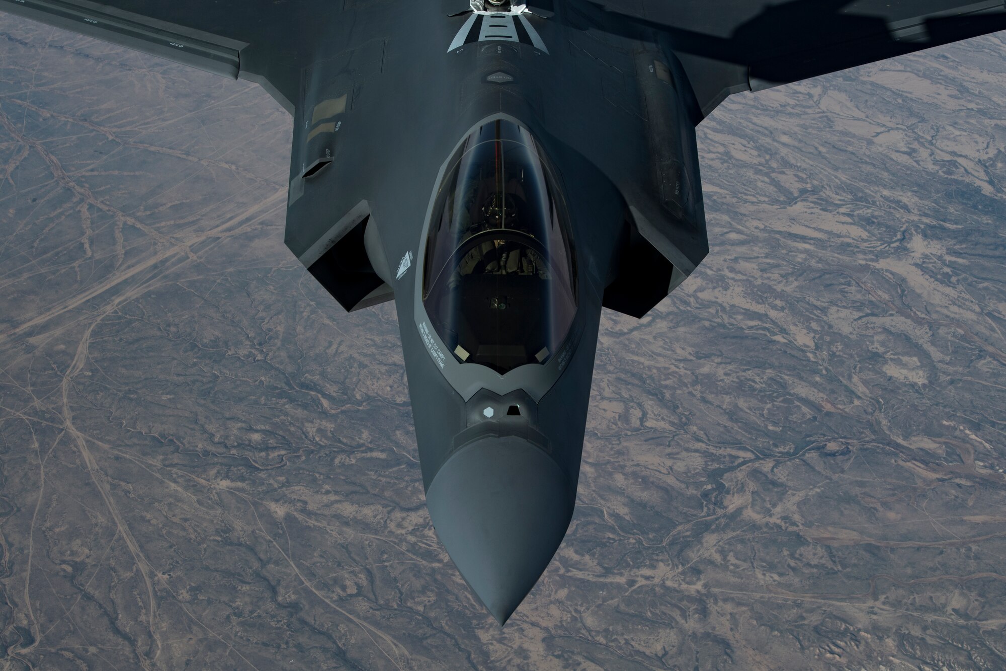 A U.S. Air Force KC-10 Extender boom operator with the 908th Expeditionary Air Refueling Squadron (EARS) from Al Dhafra Air Base (ADAB), United Arab Emirates, conducts an aerial refueling with a U.S. Air Force F-35A Lightning II assigned to the 34th Expeditionary Fighter Squadron, also from ADAB, in support of Operation Inherent Resolve, Dec. 17, 2019.