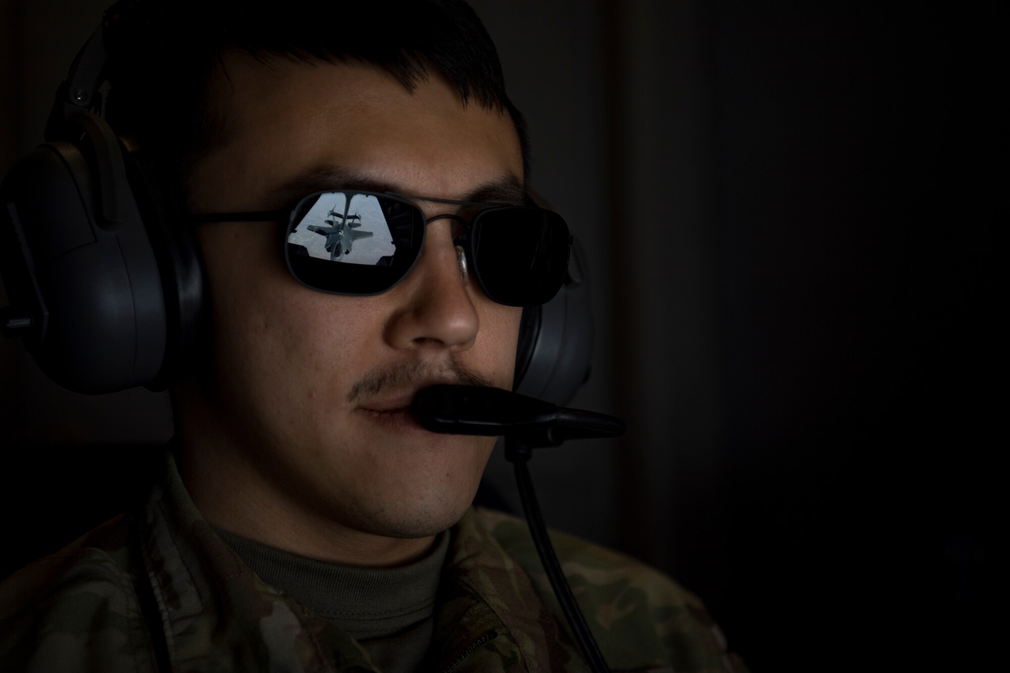 A U.S. Air Force KC-10 Extender boom operator with the 908th Expeditionary Air Refueling Squadron (EARS) from Al Dhafra Air Base (ADAB), United Arab Emirates, conducts an aerial refueling with a U.S. Air Force F-35A Lightning II assigned to the 34th Expeditionary Fighter Squadron, also from ADAB, in support of Operation Inherent Resolve, Dec. 17, 2019.