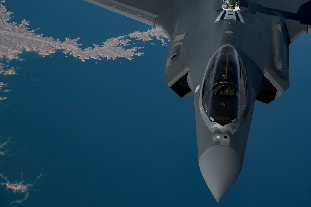 A U.S. Air Force KC-10 Extender boom operator with the 908th Expeditionary Air Refueling Squadron (EARS) from Al Dhafra Air Base (ADAB), United Arab Emirates, conducts an aerial refueling with a U.S. Air Force F-35A Lightning II assigned to the 34th Expeditionary Fighter Squadron, also from ADAB, in support of Operation Inherent Resolve, Dec. 17, 2019.