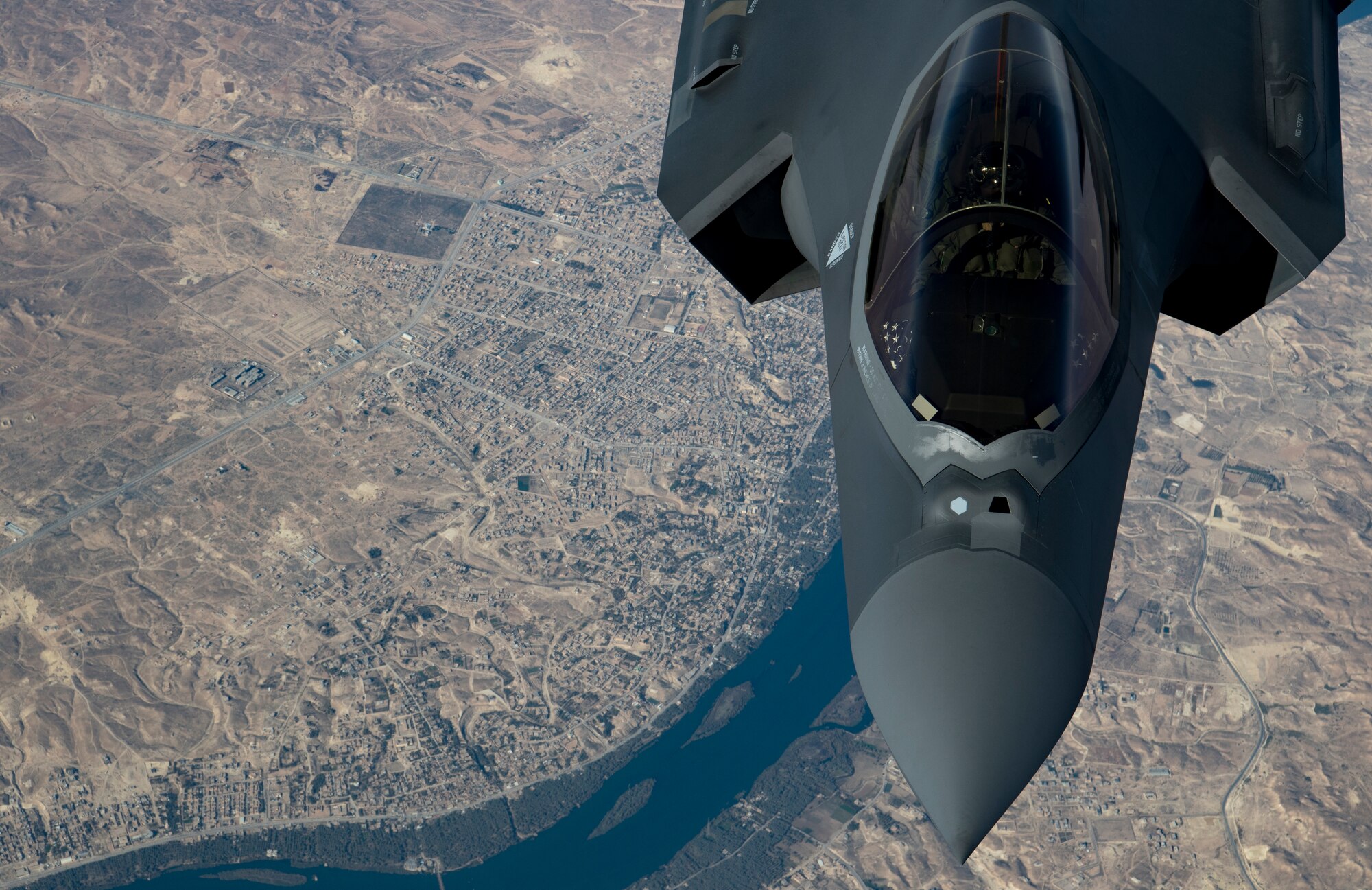 A U.S. Air Force KC-10 Extender boom operator with the 908th Expeditionary Air Refueling Squadron (EARS) from Al Dhafra Air Base (ADAB), United Arab Emirates, conducts an aerial refueling with a U.S. Air Force F-35A Lightning II assigned to the 34th Expeditionary Fighter Squadron, also from ADAB, in support of Operation Inherent Resolve, Dec. 17, 2019.