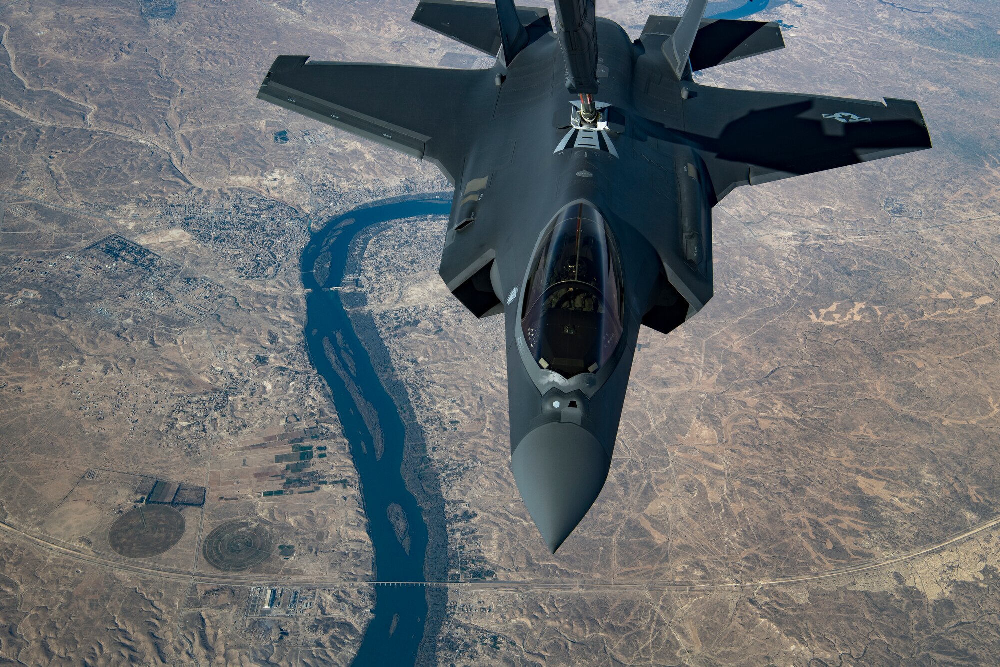 A U.S. Air Force KC-10 Extender boom operator with the 908th Expeditionary Air Refueling Squadron (EARS) from Al Dhafra Air Base (ADAB), United Arab Emirates, conducts an aerial refueling with a U.S. Air Force F-35A Lightning II assigned to the 34th Expeditionary Fighter Squadron, also from ADAB, in support of Operation Inherent Resolve, Dec. 17, 2019.
