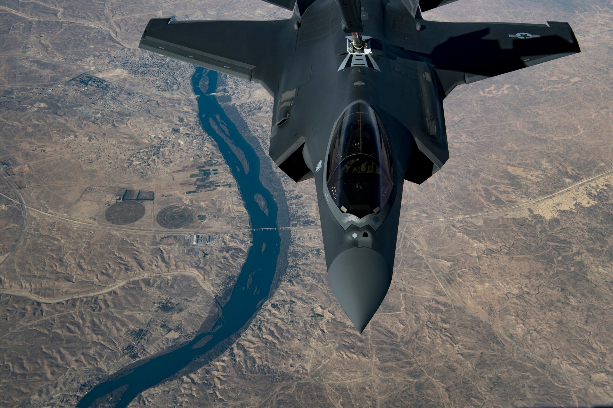 A U.S. Air Force KC-10 Extender boom operator with the 908th Expeditionary Air Refueling Squadron (EARS) from Al Dhafra Air Base (ADAB), United Arab Emirates, conducts an aerial refueling with a U.S. Air Force F-35A Lightning II assigned to the 34th Expeditionary Fighter Squadron, also from ADAB, in support of Operation Inherent Resolve, Dec. 17, 2019.