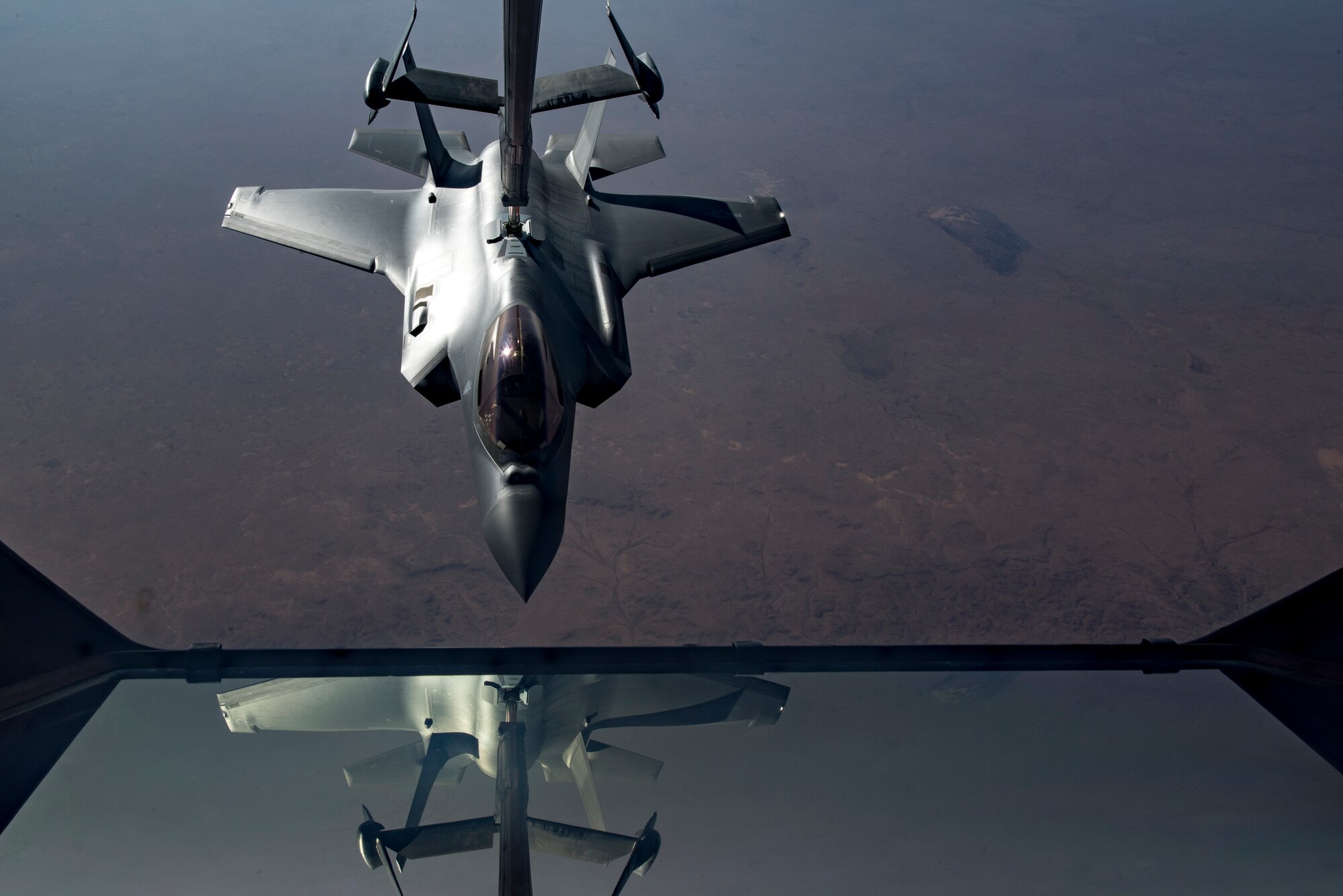 A U.S. Air Force KC-10 Extender boom operator with the 908th Expeditionary Air Refueling Squadron (EARS) from Al Dhafra Air Base (ADAB), United Arab Emirates, conducts an aerial refueling with a U.S. Air Force F-35A Lightning II assigned to the 34th Expeditionary Fighter Squadron, also from ADAB, in support of Operation Inherent Resolve, Dec. 17, 2019.