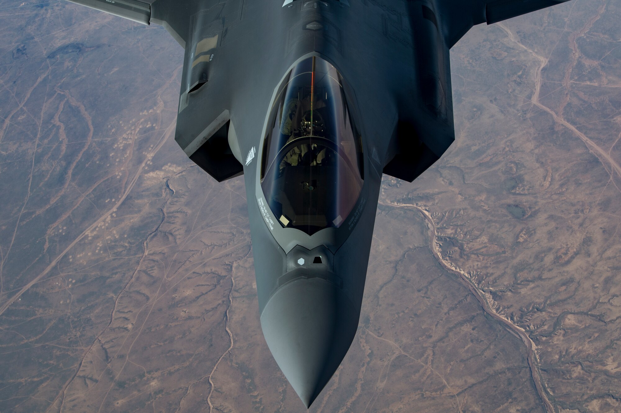 A U.S. Air Force KC-10 Extender boom operator with the 908th Expeditionary Air Refueling Squadron (EARS) from Al Dhafra Air Base (ADAB), United Arab Emirates, conducts an aerial refueling with a U.S. Air Force F-35A Lightning II assigned to the 34th Expeditionary Fighter Squadron, also from ADAB, in support of Operation Inherent Resolve, Dec. 17, 2019.