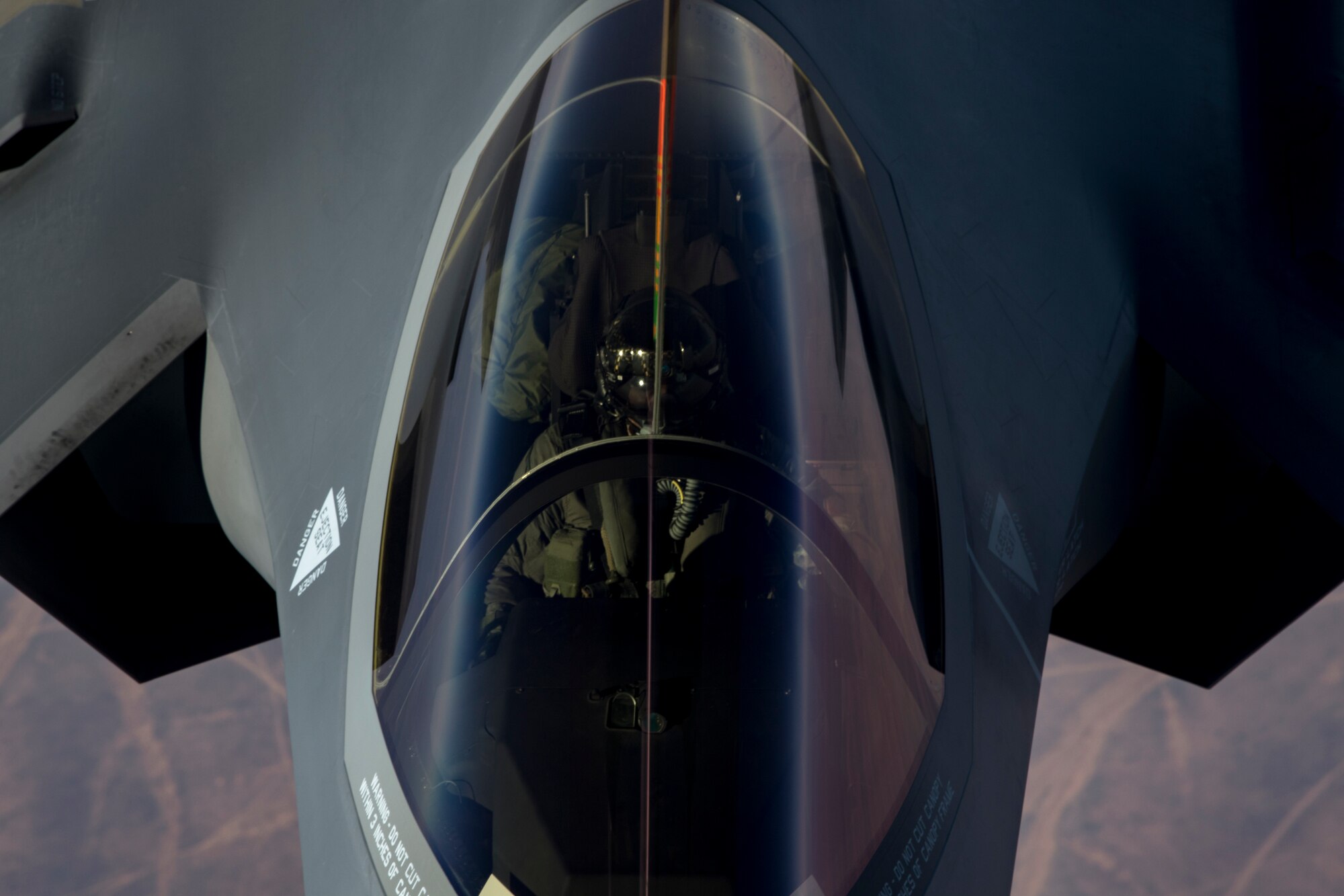 A U.S. Air Force KC-10 Extender boom operator with the 908th Expeditionary Air Refueling Squadron (EARS) from Al Dhafra Air Base (ADAB), United Arab Emirates, conducts an aerial refueling with a U.S. Air Force F-35A Lightning II assigned to the 34th Expeditionary Fighter Squadron, also from ADAB, in support of Operation Inherent Resolve, Dec. 17, 2019.