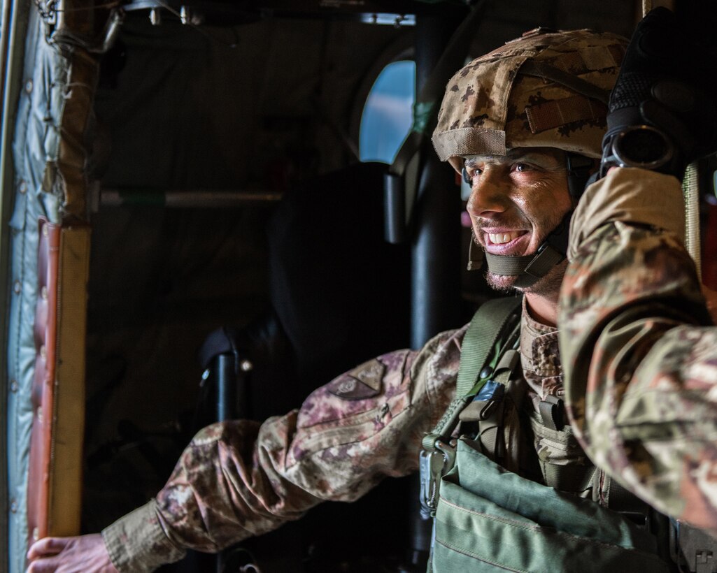 A member of the Italian Folgore, an airborne paratrooper brigade from the Italian Army, prepares to execute an airdrop mission with members of the Kentucky Air National Guard’s 123rd Airlift Wing in Pisa, Italy, on Nov. 7, 2019. The mission was part of Mangusta 19, a bi-lateral exercise designed to promote readiness and interoperability among NATO allies. (U.S. Air National Guard photo by Senior Airman Chloe Ochs)