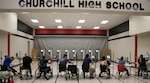 Wounded warrior active duty service members and veterans lock in on their targets during the inaugural United Warrior Air Rifle Competition at the Churchill high school Navy Junior ROTC building in San Antonio Dec. 10. UWAR is a quarterly adaptive reconditioning competition for veterans and active duty service members who are rehabilitating from a wound, injury or illness.