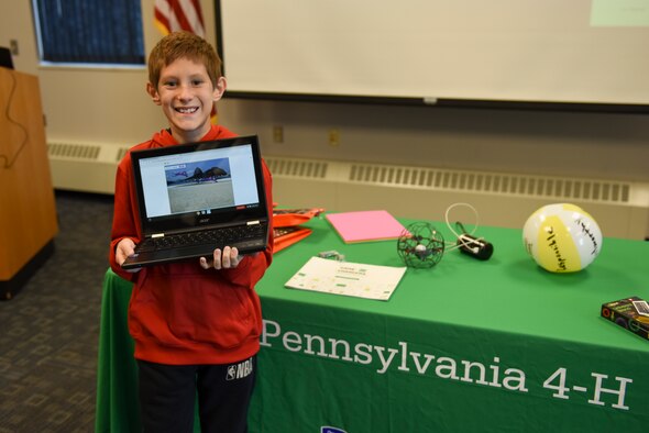 Camerin Andrulis shows off the program he created during the Pitch Your Passion portion of National 4-H Game Changers event held at the Pittsburgh International Airport Air Reserve Station, Pa., November 2, 2019.