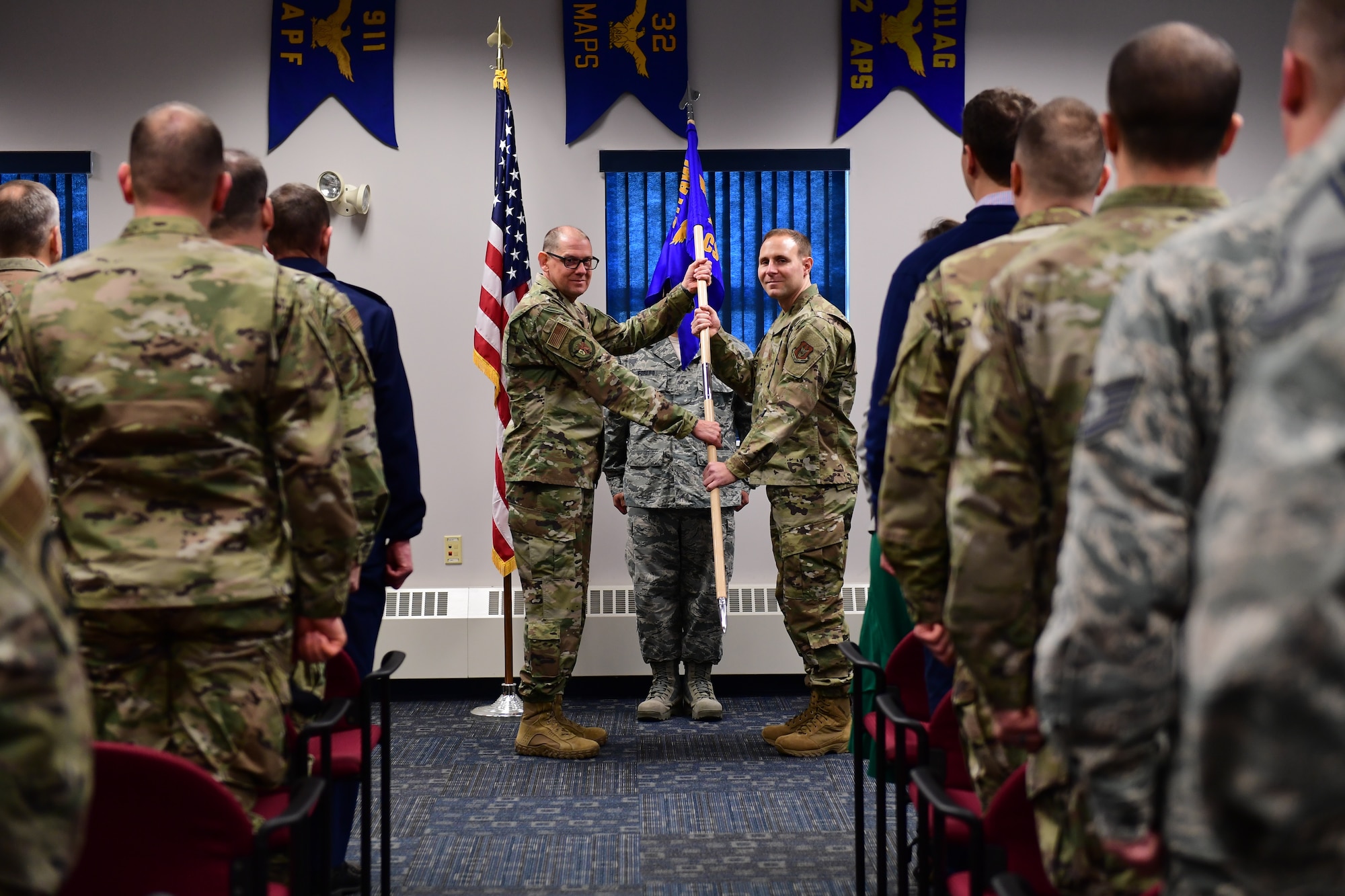 Maj. Philip Hahn assumes command of the 911th Communications Squadron from Col. Kenneth Lute, commander of the 911th Mission Support Group, at the Pittsburgh International Airport Air Reserve Station, Pa., Dec. 7, 2019.