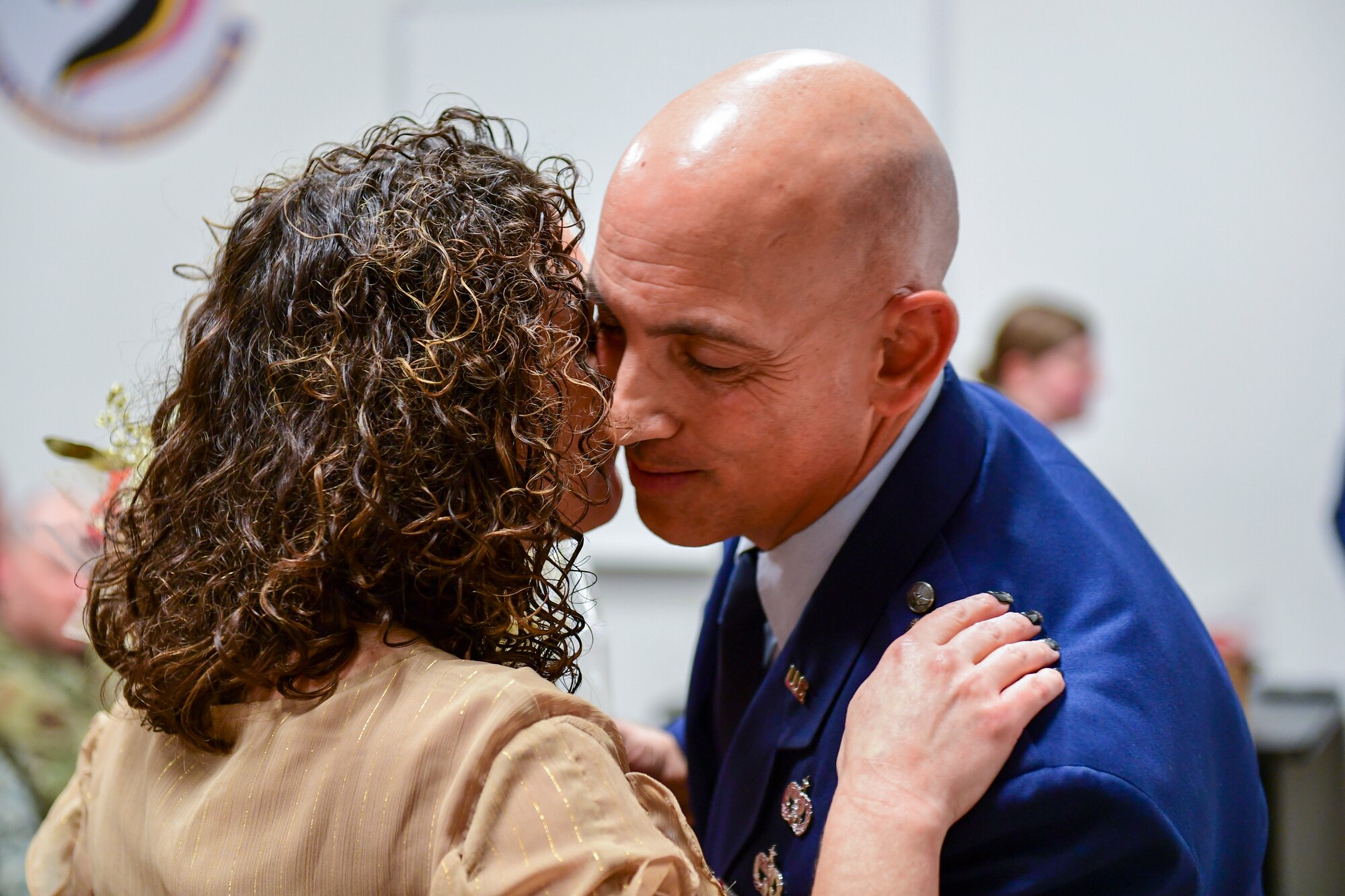 Lt. Col. Frank Mercurio, right, embraces his wife Jessica during a dual promotion and assumption of command ceremony at the Pittsburgh International Airport Air Reserve Station, Pennsylvania, Dec. 7, 2019.