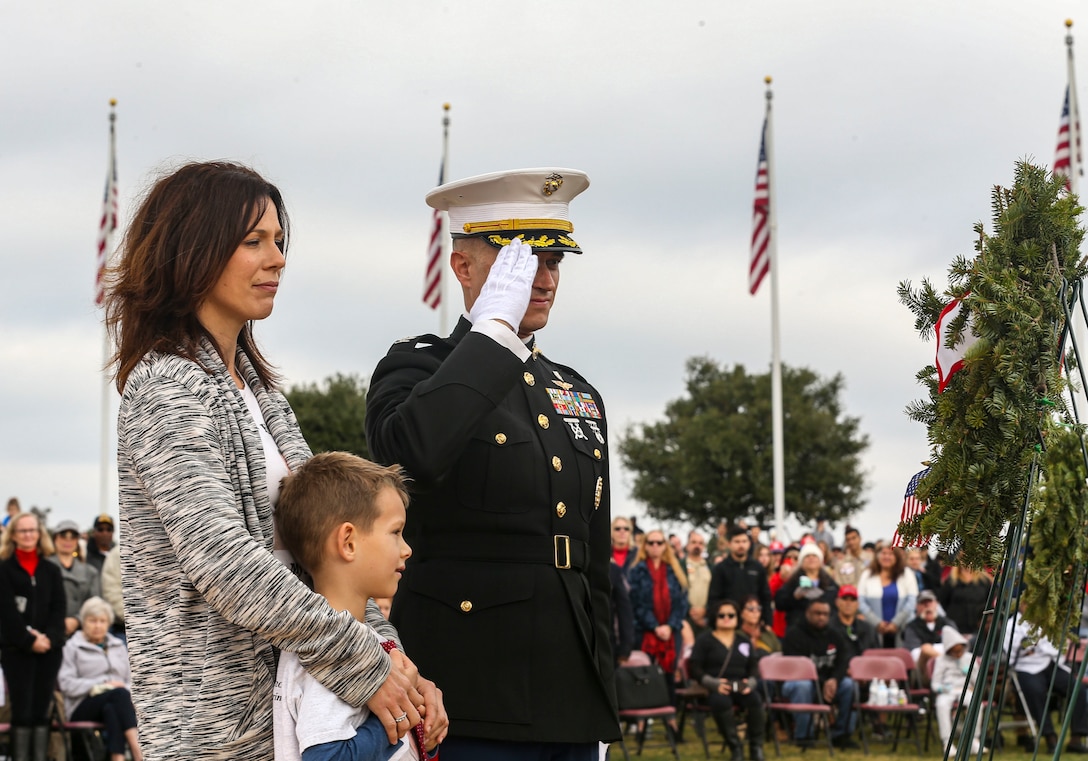 AJ Budenz, Gold Star family member, stands by his mother's side after laying a wreath on behalf of all the Gold Star Families who lost their loved ones  in San Diego, Dec. 14, 2019. The surrounding San Diego community gathered for Miramar National Cemetery’s annual Wreaths Across America ceremony to give their support to friends and family who have  lost loved ones.