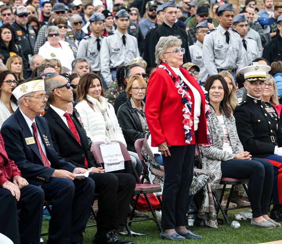 AJ Budenz, Gold Star family member, stands by his mother's side after laying a wreath on behalf of all the Gold Star Families who lost their loved ones  in San Diego, Dec. 14, 2019. The surrounding San Diego community gathered for Miramar National Cemetery’s annual Wreaths Across America ceremony to give their support to friends and family who have  lost loved ones.