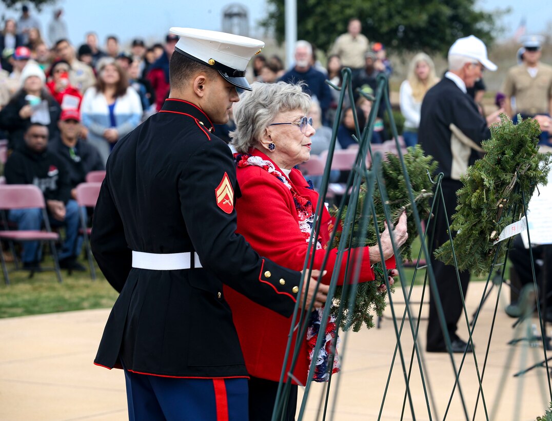 AJ Budenz, Gold Star family member, stands by his mother's side after laying a wreath on behalf of all the Gold Star Families who lost their loved ones  in San Diego, Dec. 14, 2019. The surrounding San Diego community gathered for Miramar National Cemetery’s annual Wreaths Across America ceremony to give their support to friends and family who have  lost loved ones.