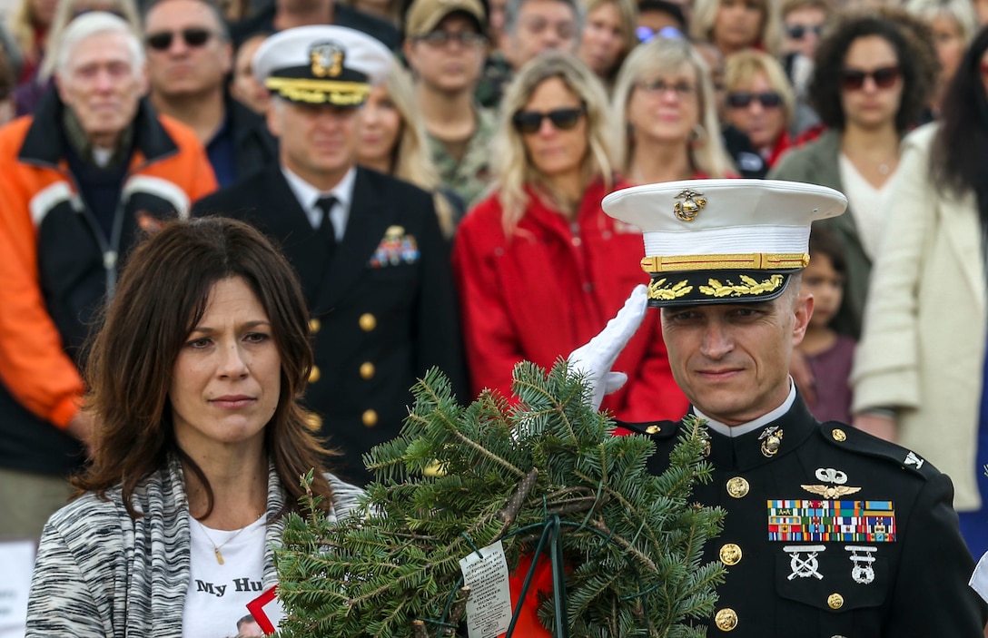 AJ Budenz, Gold Star family member, stands by his mother's side after laying a wreath on behalf of all the Gold Star Families who lost their loved ones  in San Diego, Dec. 14, 2019. The surrounding San Diego community gathered for Miramar National Cemetery’s annual Wreaths Across America ceremony to give their support to friends and family who have  lost loved ones.