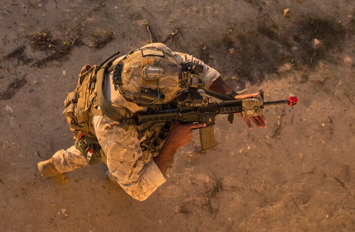 A Marine Raider with Marine Forces Special Operations Command conducts high-value target detainment and evacuation operations during a multipurpose canine handler training course hosted by 1st Marine Raider Battalion on Marine Corps Base Camp Pendleton, California, Dec. 19.
