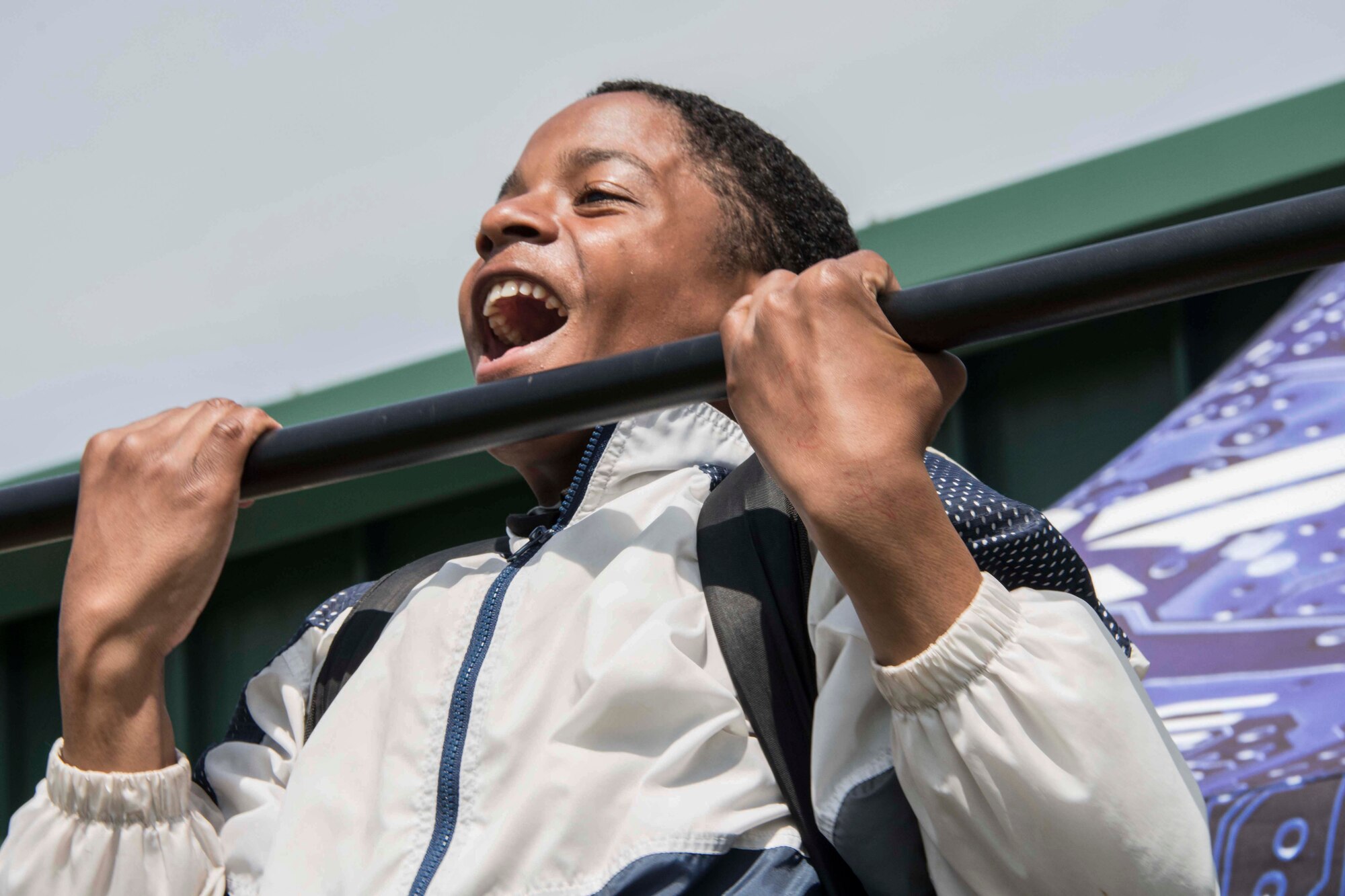 Photo of student performing a pull up