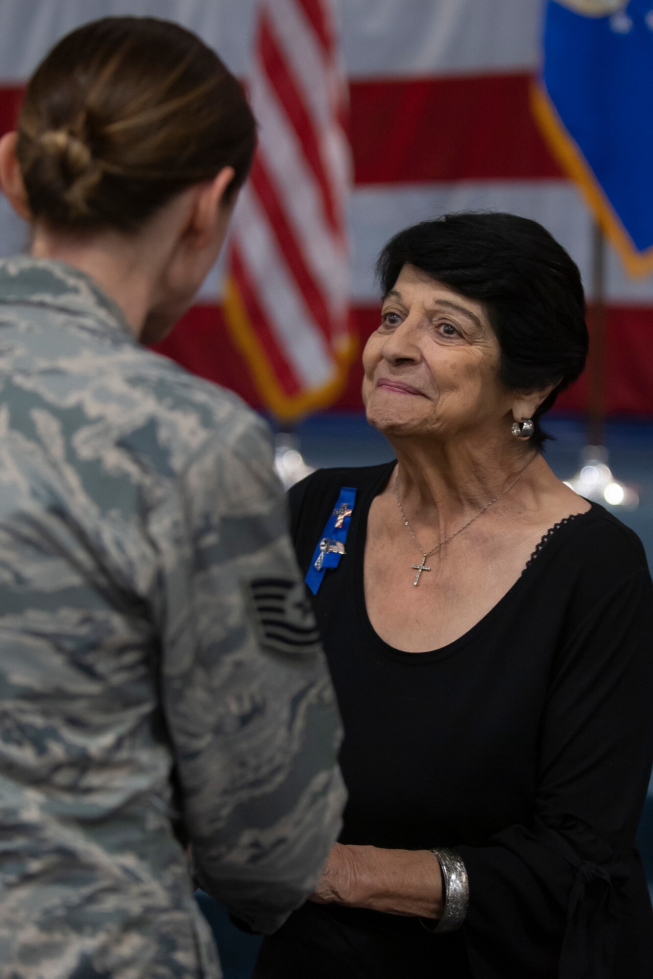 Photo of Catherine Vanderberry greeting guest.