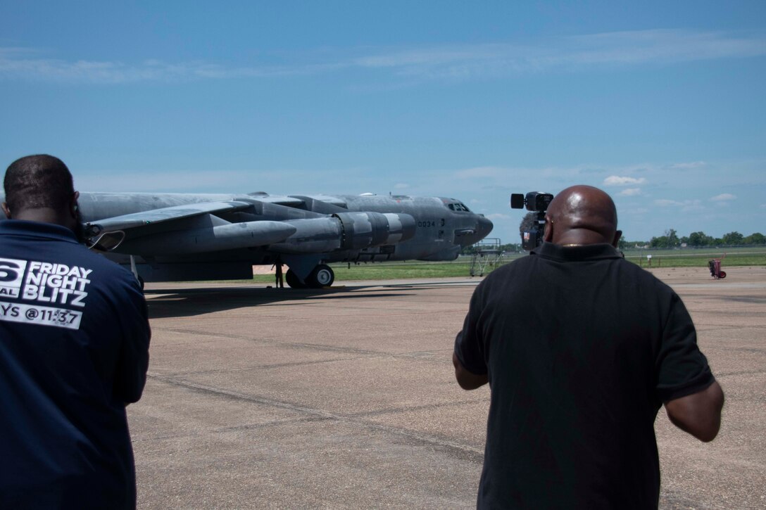 TV crew videotaping B-52 Stratofortress