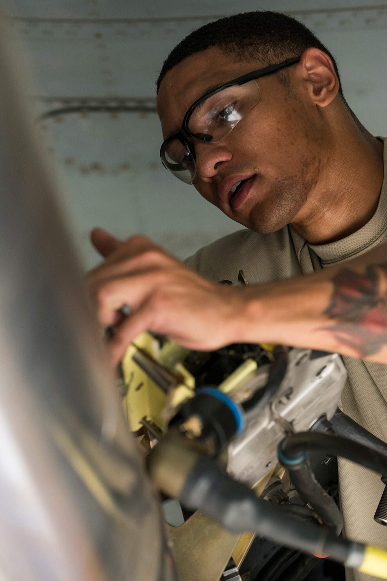 Photo of Airman working on jet