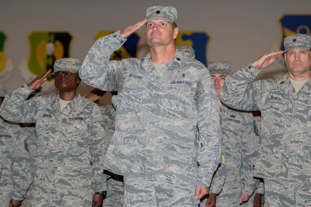 Photo of Airmen saluting