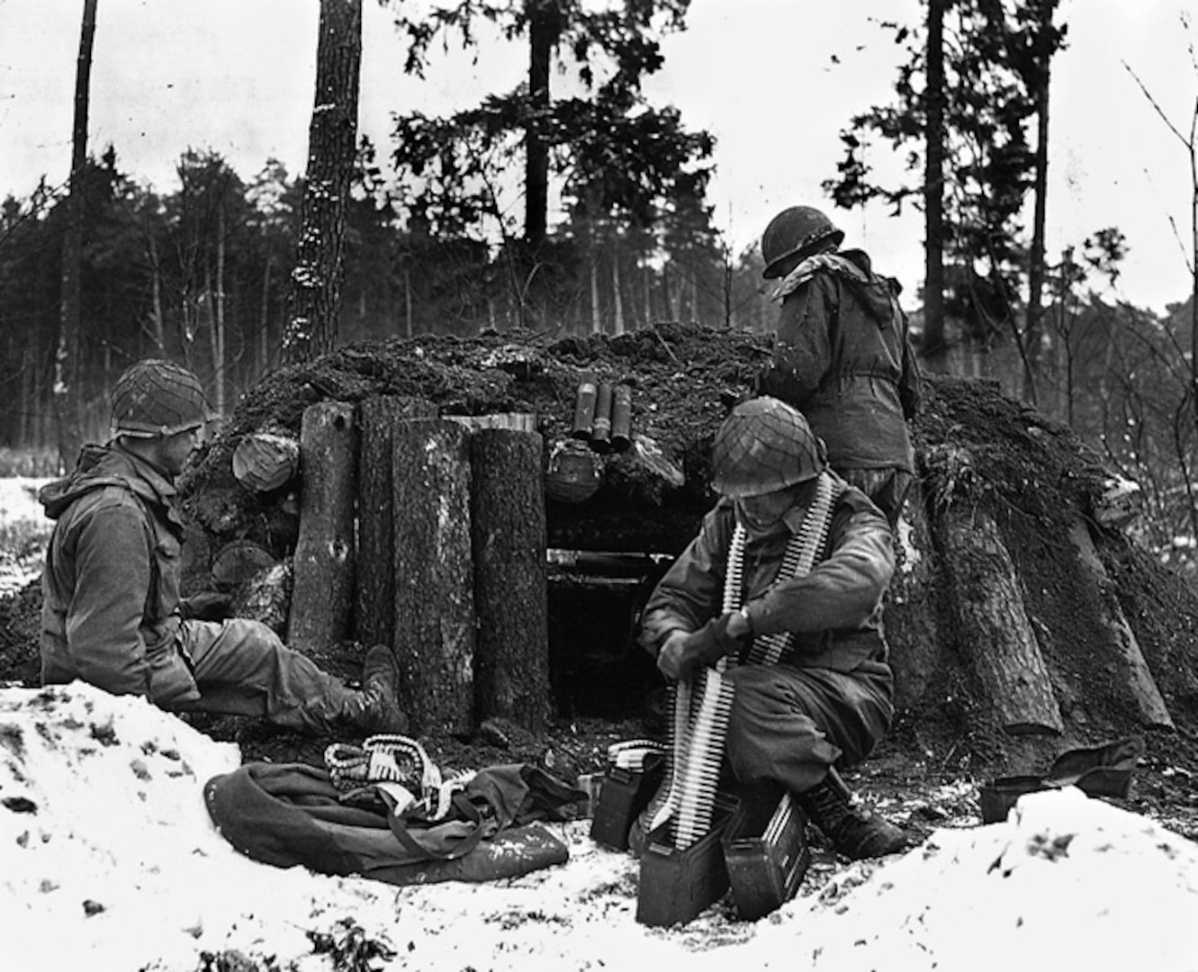 U.S. Army Soldiers of the 42nd Infantry Division prepare a defensive position at their log and dirt bunker near Kauffenheim, France, Jan. 8, 1945. The Soldiers, assigned to Company I, 242nd Regiment, held off the German offensive in Alsace, France, called Operation Nordwind without the division’s artillery or support elements. The actions of one division Soldier, Master Sgt. Vito Bertoldo, were highlighted in the 2018 Netflix documentary “Medal of Honor.”