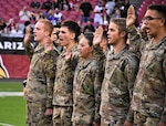 Future Soldiers from the Phoenix Recruiting Battalion, National Guard and Marines, recite the Oath of Enlistment during a mass enlistment ceremony Dec. 1, 2019, at State Farm Stadium, Glendale, Ariz. The ceremony took place shortly before a National Football League football game between the Arizona Cardinals and Los Angeles Rams.