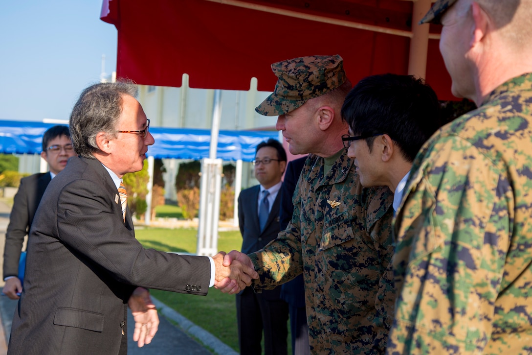 U. S. Marine Corps Brig. Gen. Christopher McPhillips, deputy commanding general of III Marine Expeditionary Force, welcomes Okinawa Governor Denny Tamaki to Camp Kinser, Okinawa, Japan, Jan. 31, 2019. During the tour, the governor and members of his staff were briefed on base consolidation plans and viewed progress on projects related to recent land returns around Camp Kinser to the Government of Japan. (U.S. Marine Corps photo by Lance Cpl. Nicole Rogge)