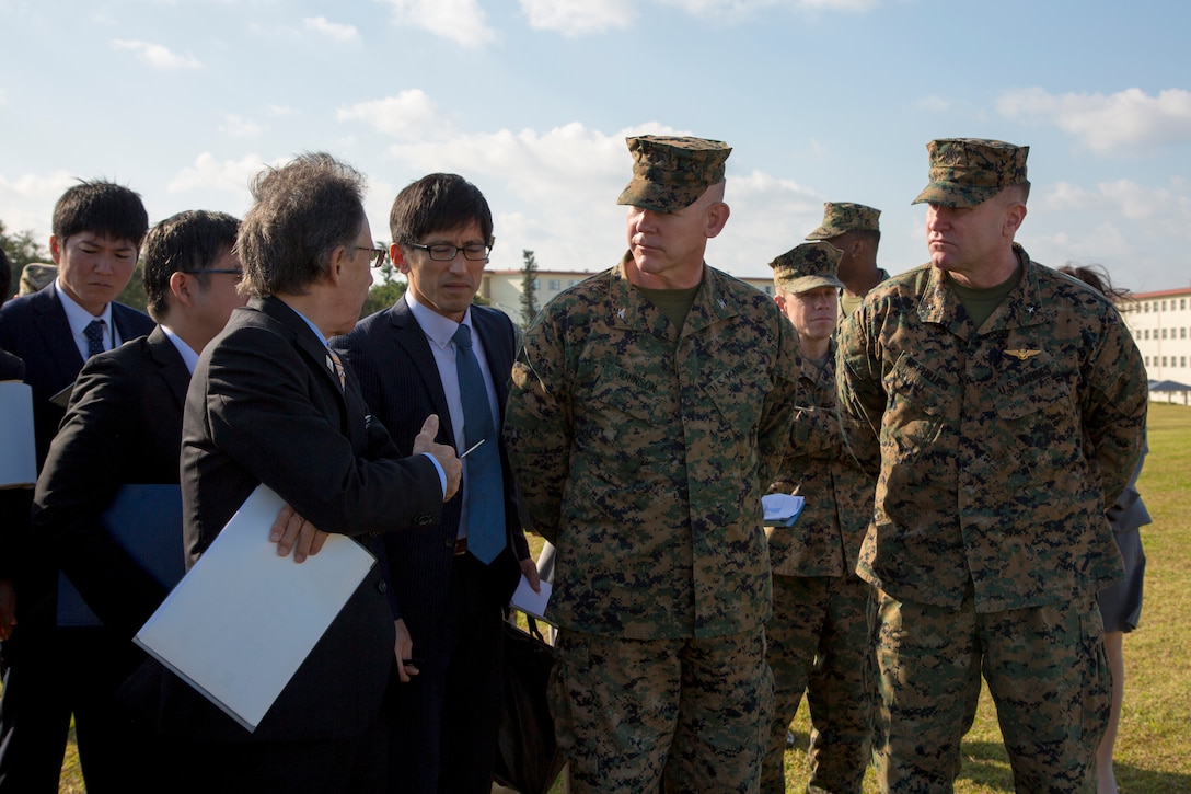 U. S. Marine Corps Col. Scott Johnson, the camp commander of Camp Kinser, discusses the development of land on the western perimeter with Okinawa Governor Denny Tamaki during a tour on Camp Kinser, Okinawa, Japan, Jan. 31, 2019. During the tour, the governor and members of his staff were briefed on base consolidation plans and viewed progress on projects related to recent land returns around Camp Kinser to the Government of Japan. (U.S. Marine Corps photo by Lance Cpl. Nicole Rogge)