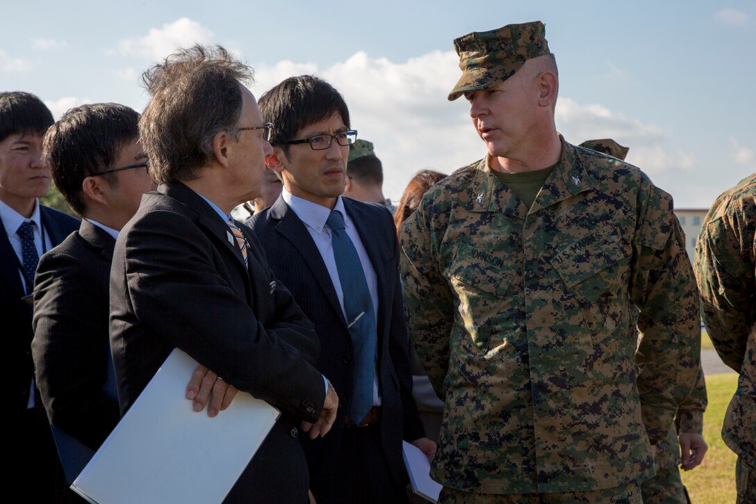 U. S. Marine Corps Col. Scott Johnson, the camp commander of Camp Kinser, discusses the development of land on the western perimeter with Okinawa Governor Denny Tamaki during a tour on Camp Kinser, Okinawa, Japan, Jan. 31, 2019. During the tour, the governor and members of his staff were briefed on base consolidation plans and viewed progress on projects related to recent land returns around Camp Kinser to the Government of Japan. (U.S. Marine Corps photo by Lance Cpl. Nicole Rogge)