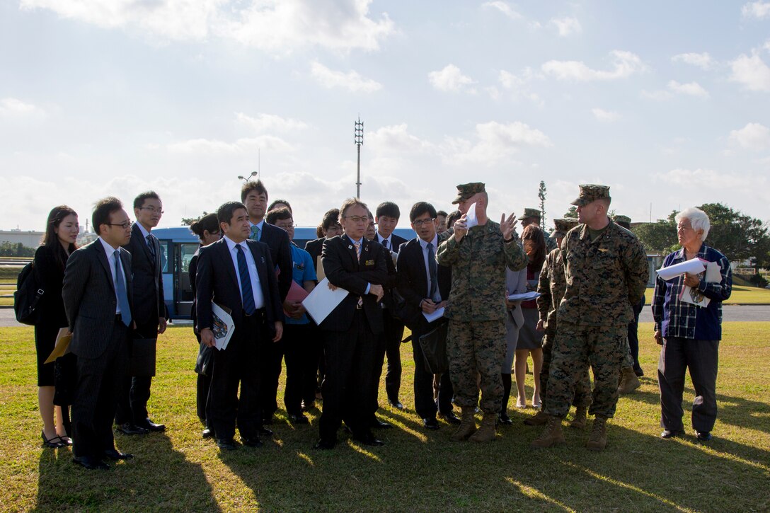 U. S. Marine Corps Col. Scott Johnson, the camp commander of Camp Kinser, discusses the development of land on the western perimeter with Okinawa Governor Denny Tamaki during a tour on Camp Kinser, Okinawa, Japan, Jan. 31, 2019. During the tour, the governor and members of his staff were briefed on base consolidation plans and viewed progress on projects related to recent land returns around Camp Kinser to the Government of Japan. (U.S. Marine Corps photo by Lance Cpl. Nicole Rogge)