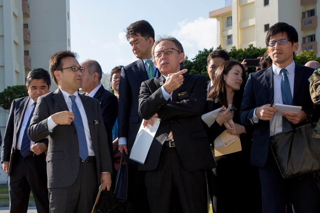 Okinawa Governor Denny Tamaki observes progress of the Minatagawa Bypass Project and relocation of a gate for Camp Kinser, Okinawa, Japan, Jan. 31, 2019. The project is a bilateral agreement that return tracts of Camp Kinser in phases to enable the construction of a bypass road to relieve local traffic congestion. (U.S. Marine Corps photo by Lance Cpl. Nicole Rogge)