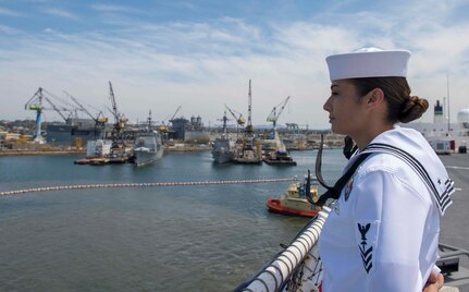 Hospital Corpsman 1st Class Karla Quintero mans the rails aboard USNS Mercy as the ship arrives at Naval Base San Diego after participating in Pacific Partnership 2018.