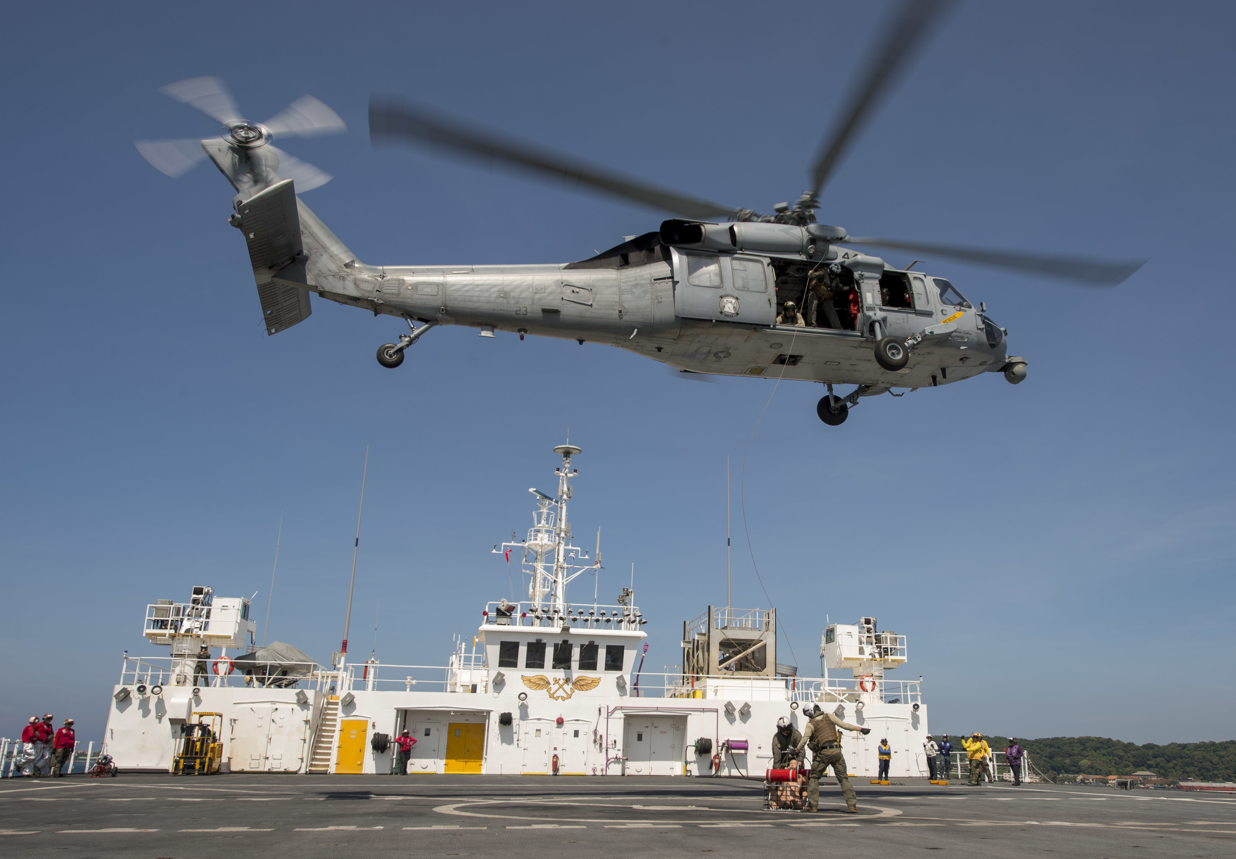 HSC-23 Sailors load a training dummy into a rescue litter aboard USNS Mercy as part of Pacific Partnership 2018 humanitarian assistance exercise..