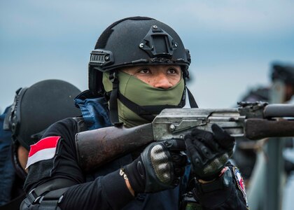 An Indonesian Coast Guardsman participates in a VBSS practical scenario during SEACAT 2018.