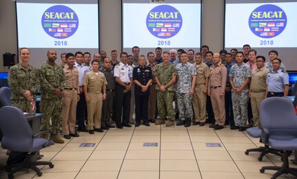 SEACAT 2018 exercise participants pose for a photo during the exercise's cosing ceremony.