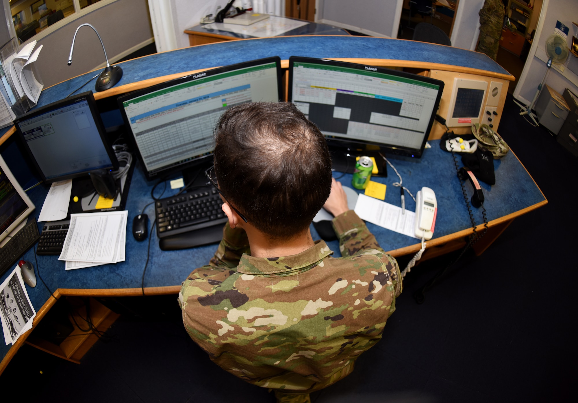 U.S. Air Force Senior Airman Deandre Timpson, 100th Operations Support Squadron Airfield Management shift lead, looks over aircraft flight plans at RAF Mildenhall, England, Jan. 31, 2019. Airfield management coordinate flight plans with Eurocontrol (The European Organisation for the Safety of Air Navigation), who provide free-flowing air traffic management across European airspace. (U.S. Air Force photo by Airman 1st Class Brandon Esau)