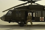 Spc. Daryn Colledge, a UH-60 Black Hawk repairer in the Idaho National Guard, poses for picture at Kandahar Airfield, Afghanistan, July 28, 2018. "Joining the Army National Guard was a two part choice," said Colledge. "First, I wanted to remain in Boise, Idaho and second as a private pilot in my civilian life, I wanted to continue to fly in my Army career."